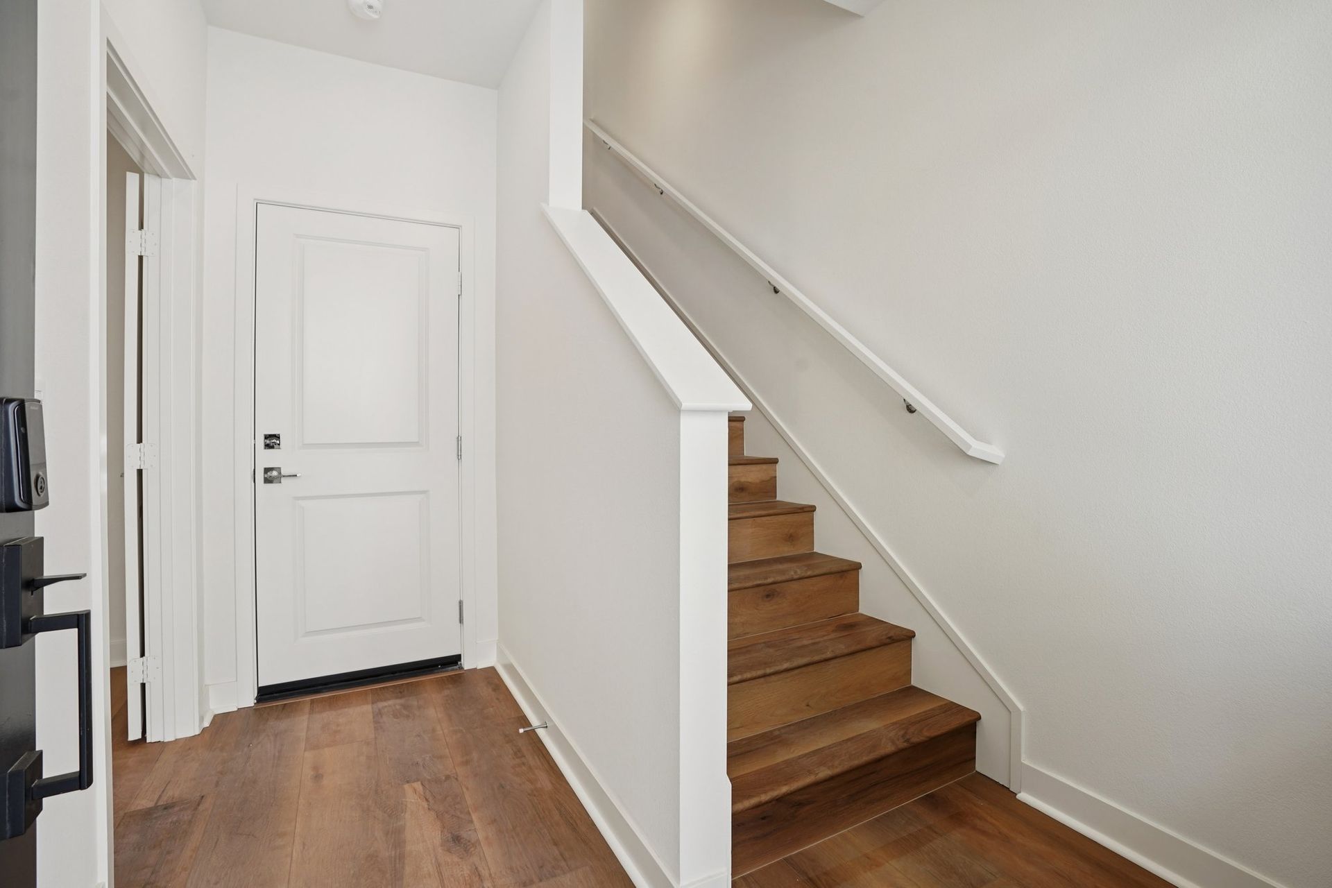 Entry stair case with upgraded flooring throughout 