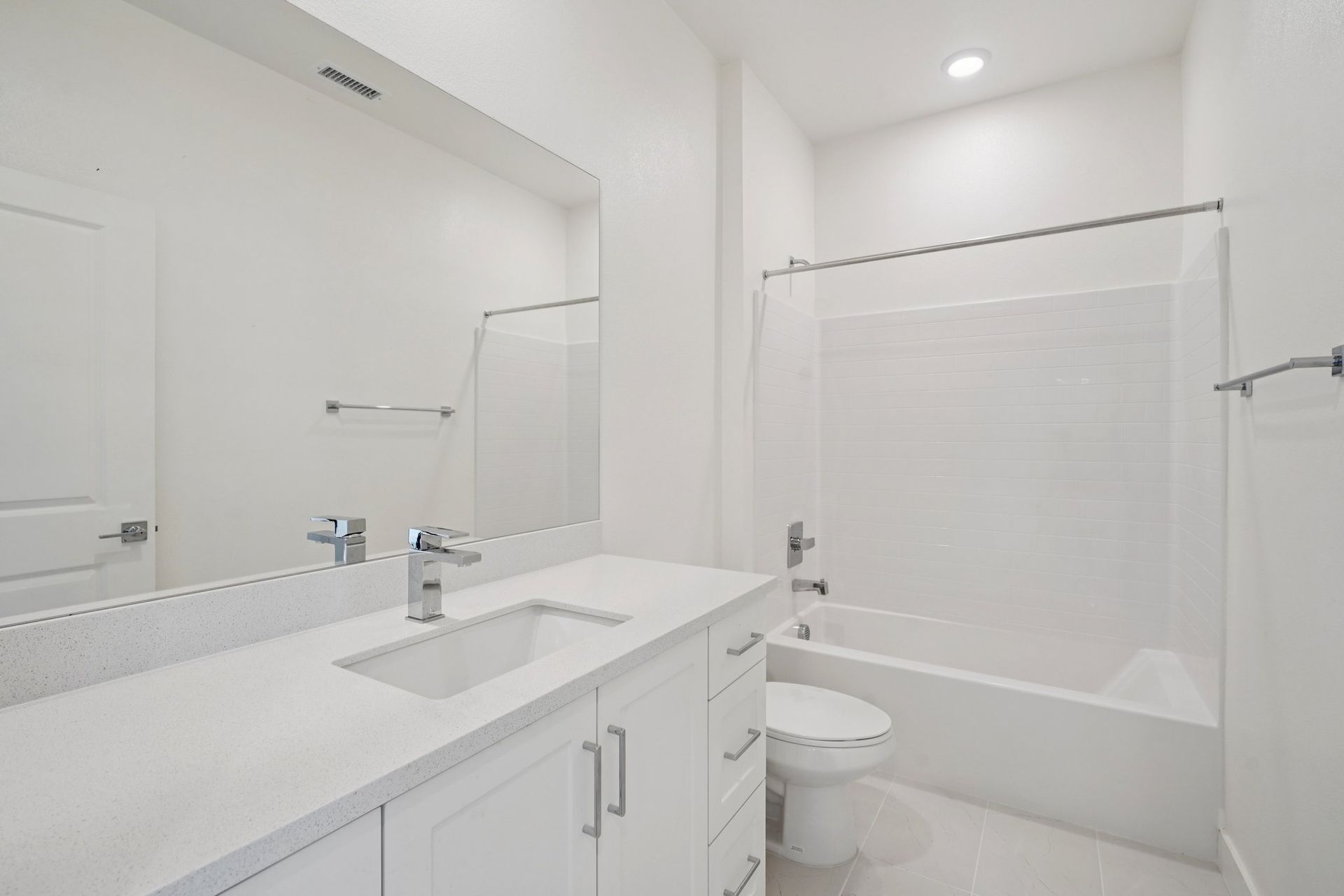 Convenient full bathroom with vanity and shower