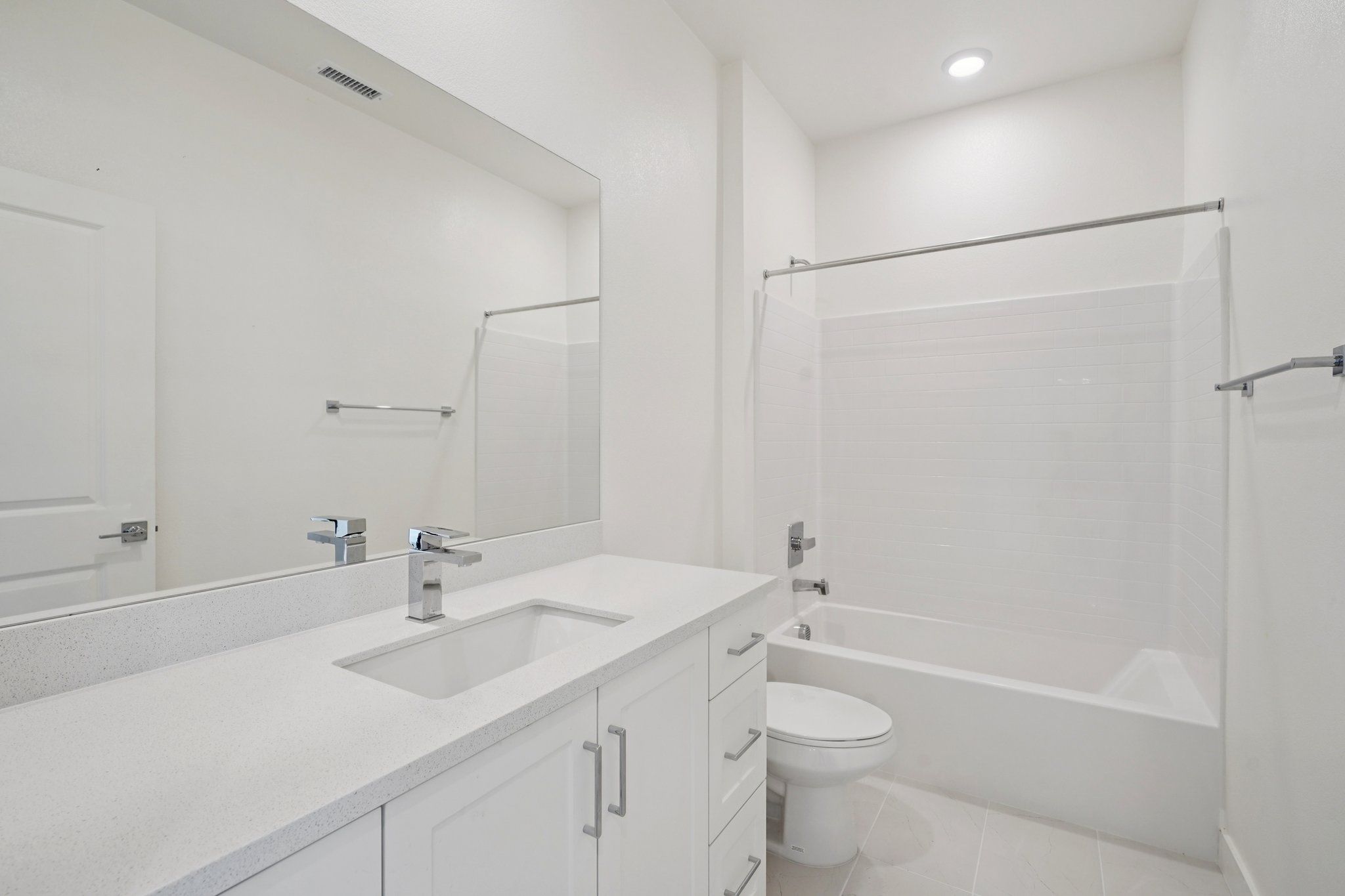 Convenient full bathroom with vanity and shower