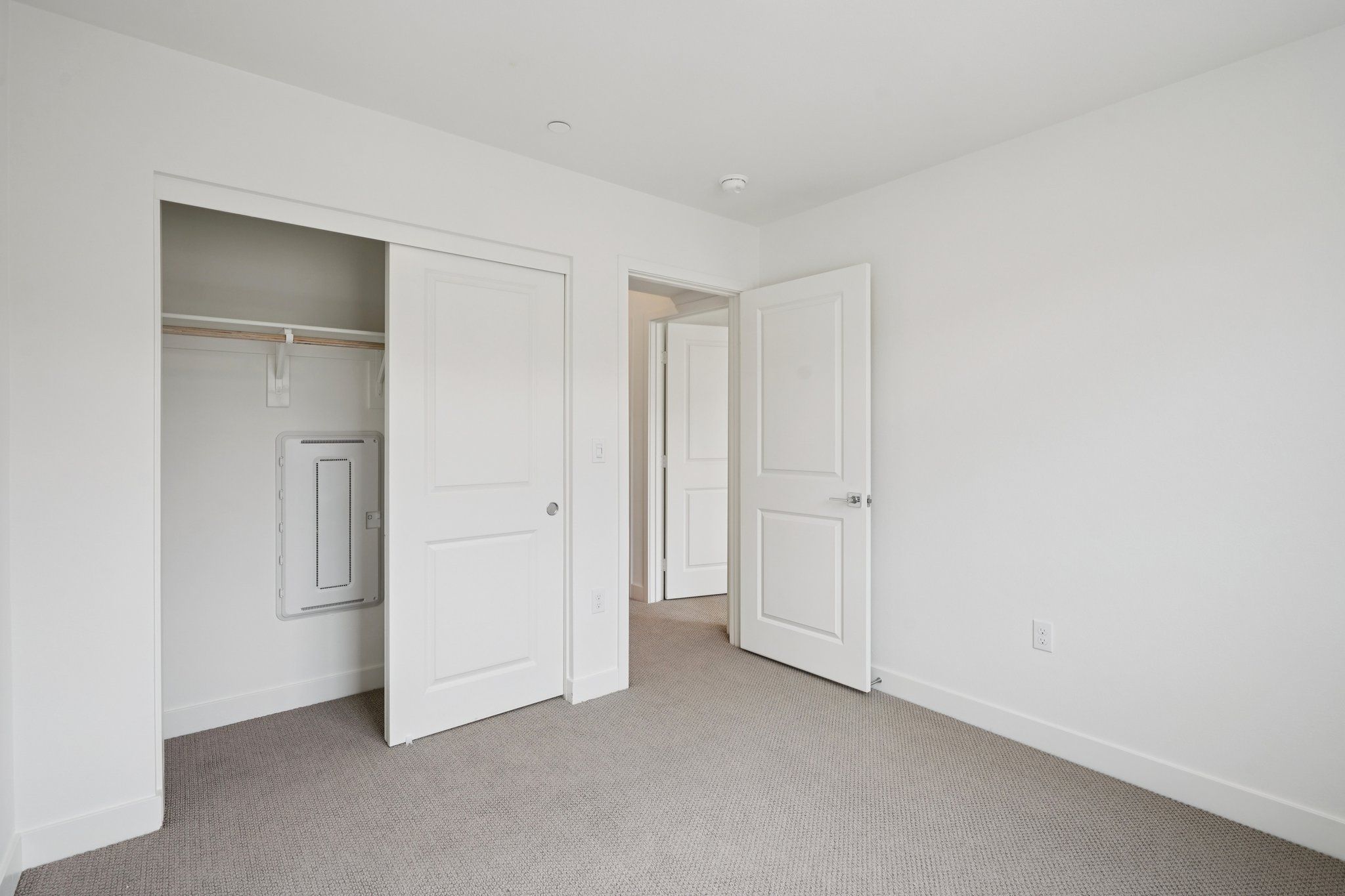 Secondary bedroom 3 with upgraded flooring and closet