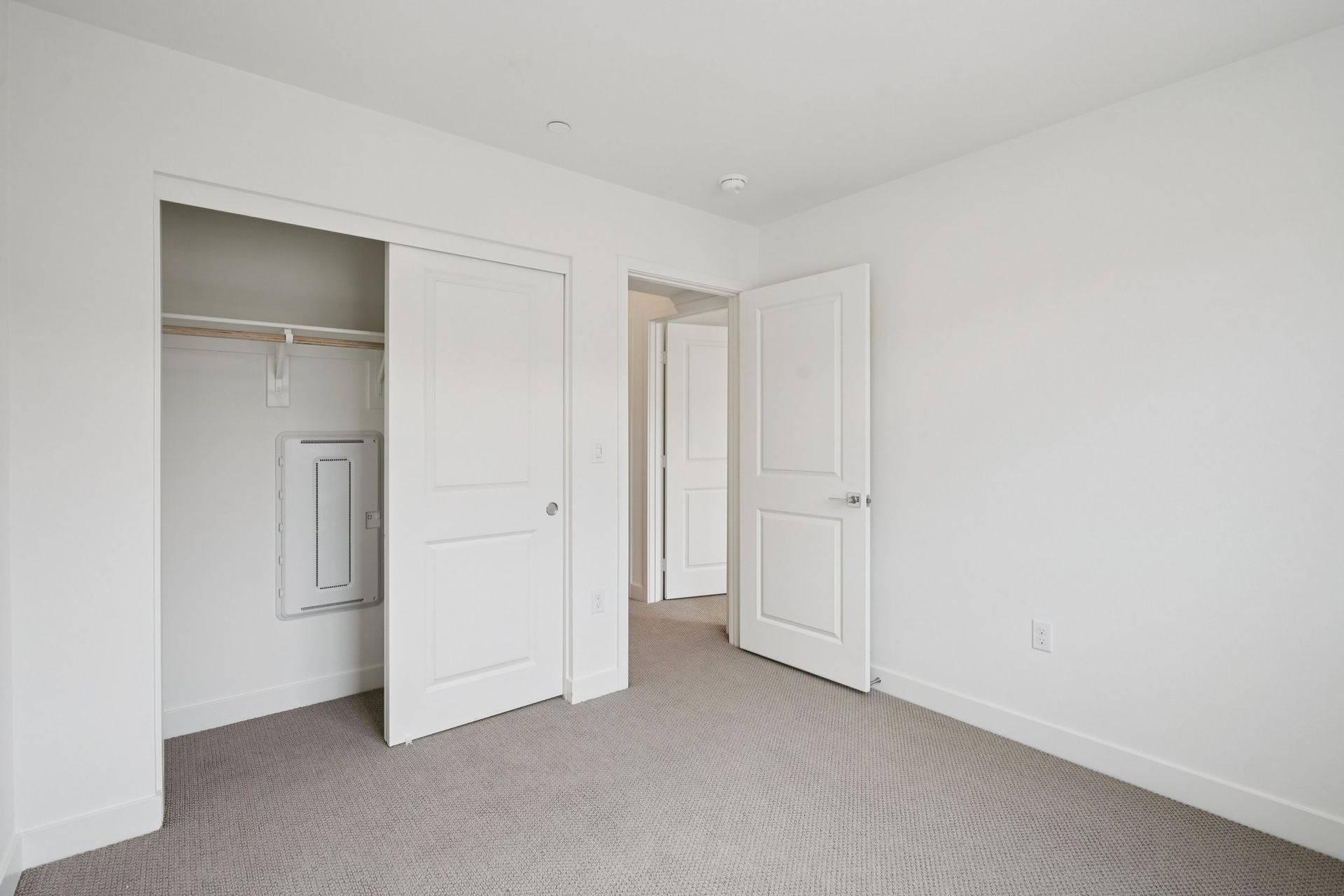 Secondary bedroom 3 with upgraded flooring and closet