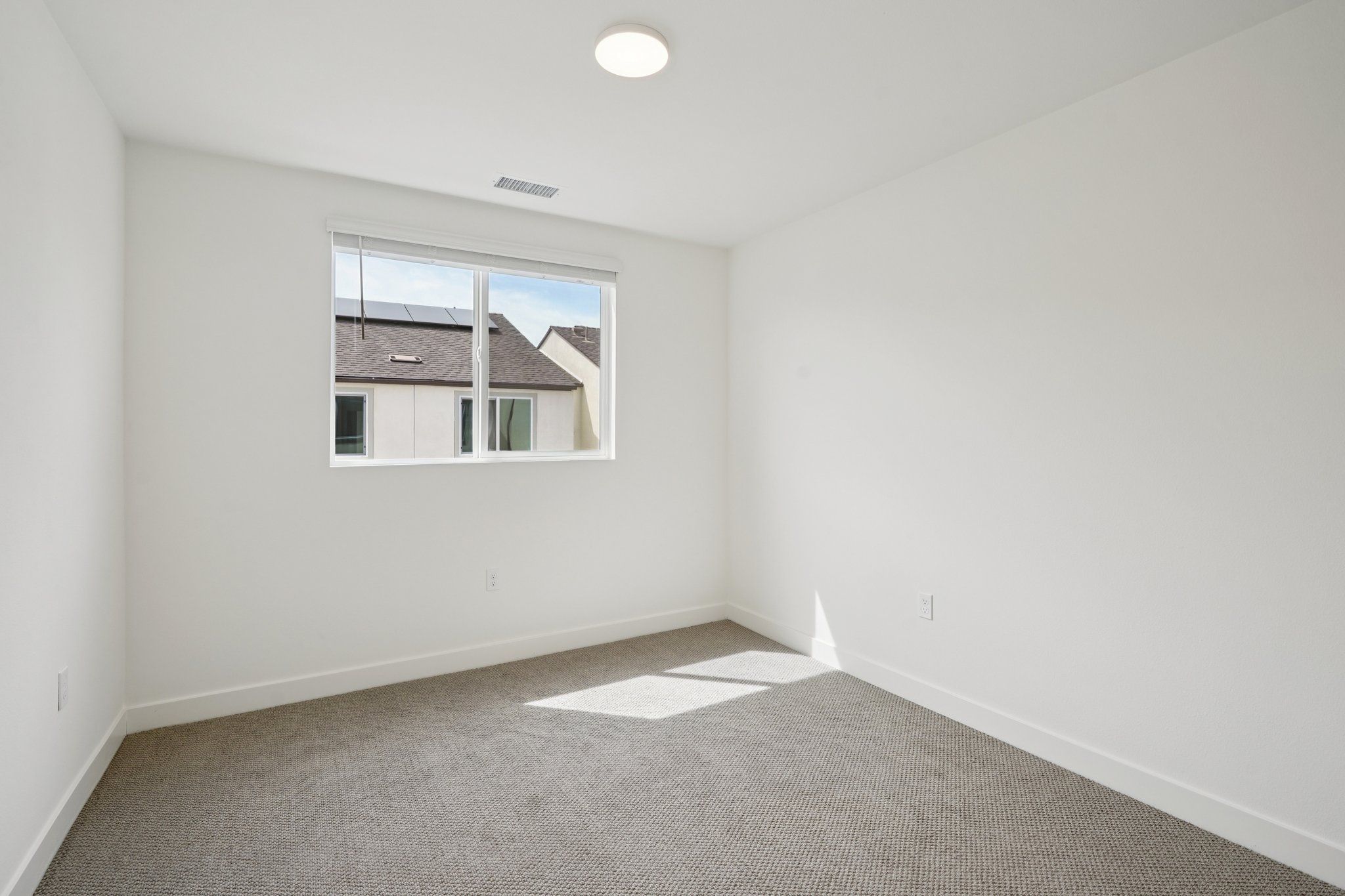 Well-proportioned secondary bedroom 3 with a large window and balanced design
