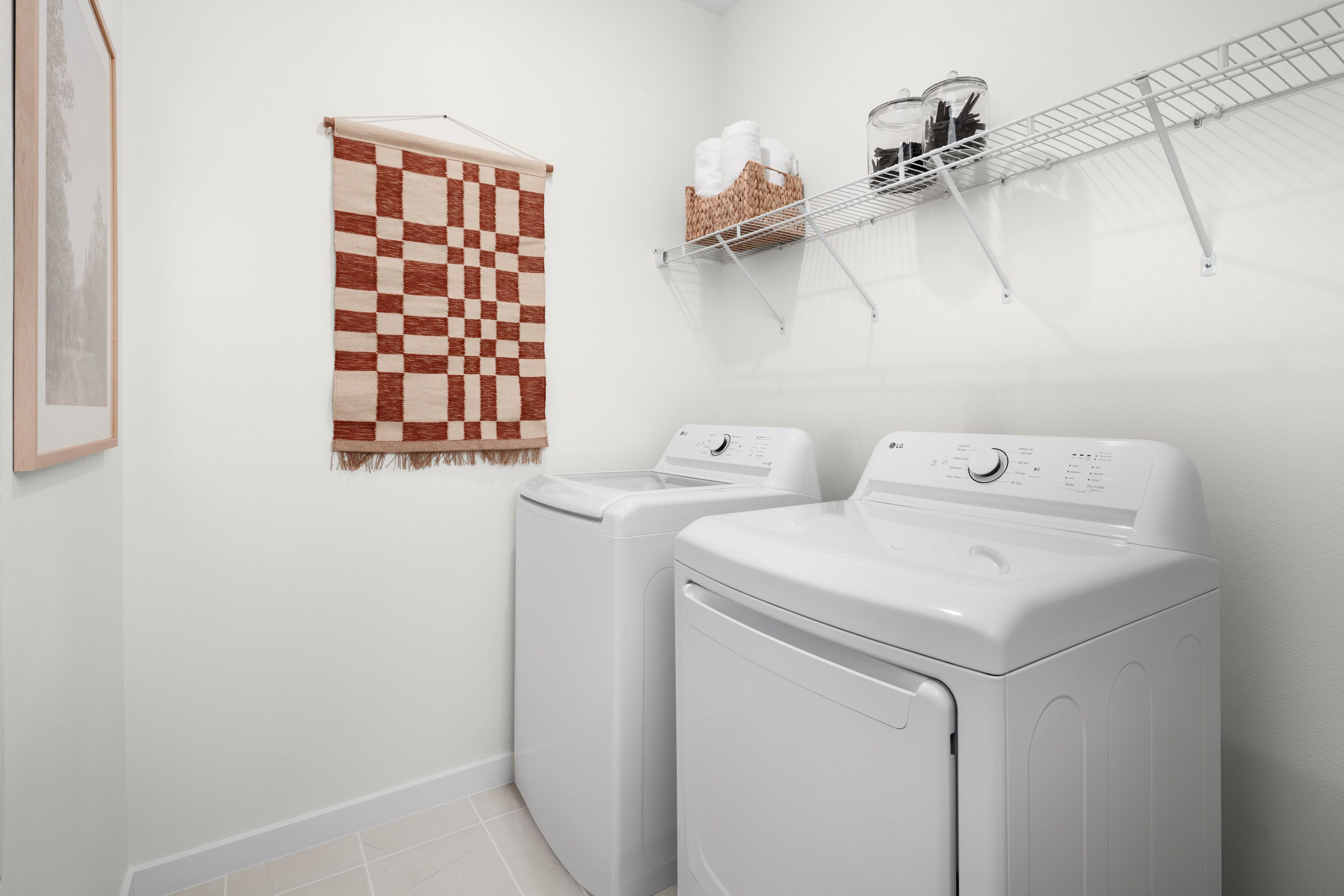 Plan 1 model home second floor laundry room with room for side-by-side appliances