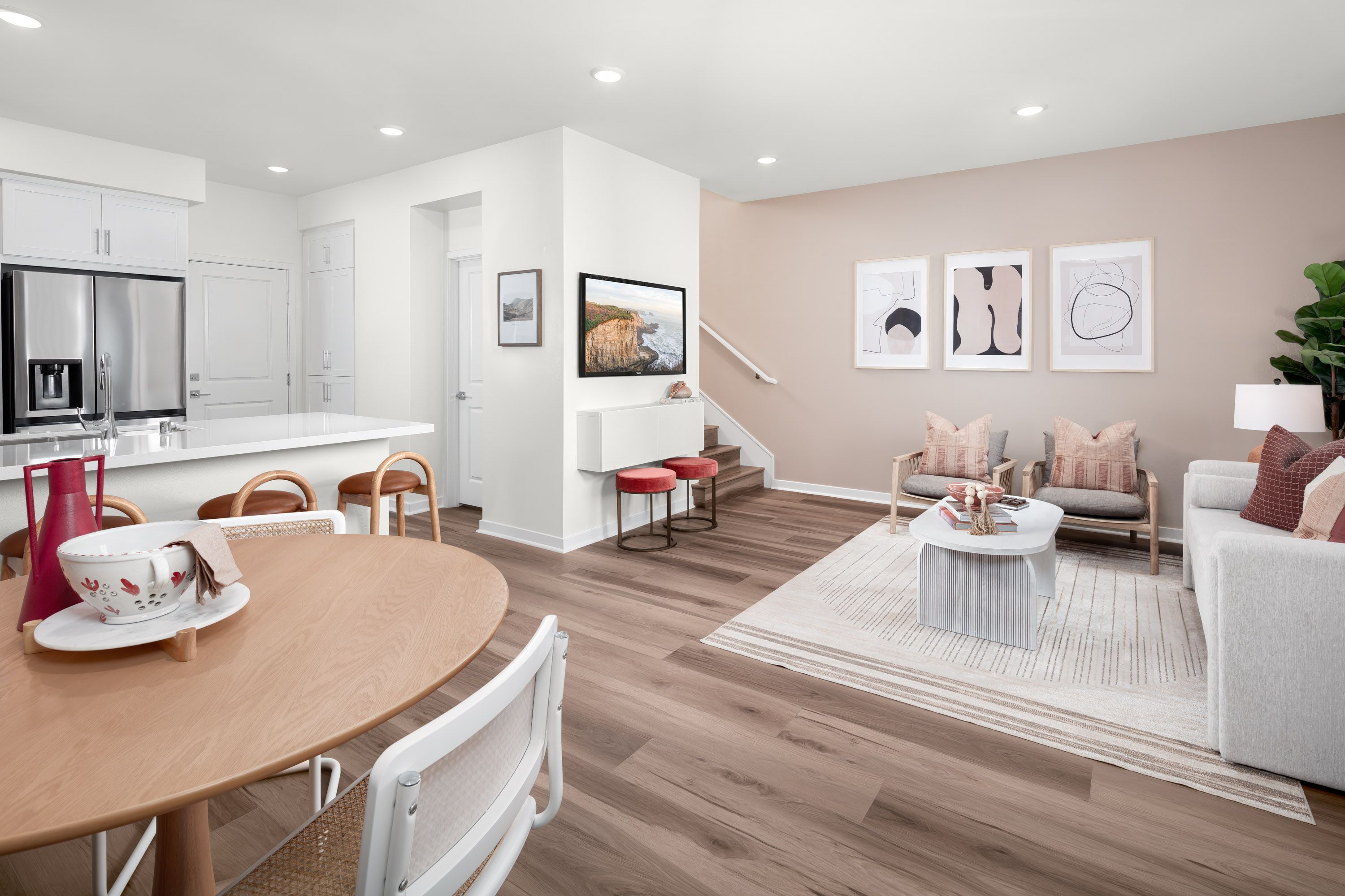 Plan 1 model home great room with kitchen, dining, and living area