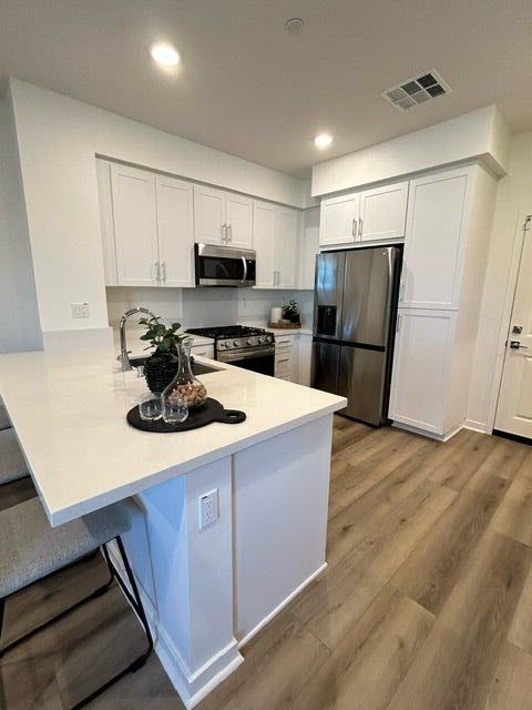 Plan 2 model home kitchen equipped with select stainless steel appliances