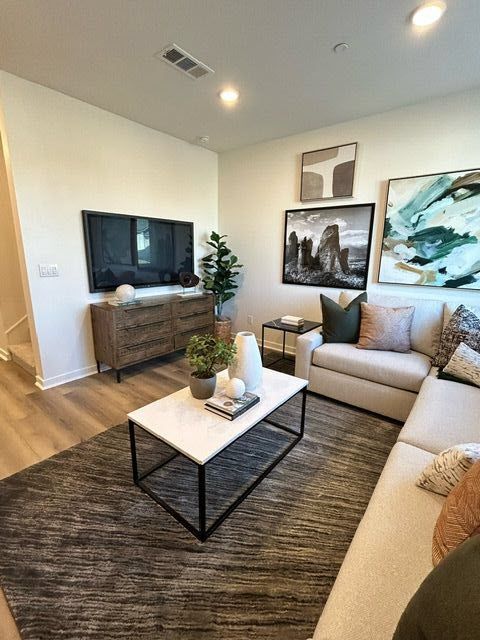 Plan 2 model home bright and inviting living area featuring wide-plank flooring