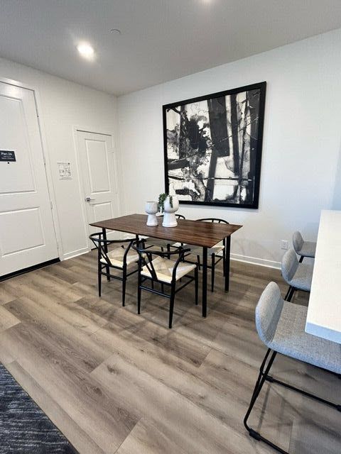 Plan 2 model home dining area conveniently located beside the kitchen peninsula
