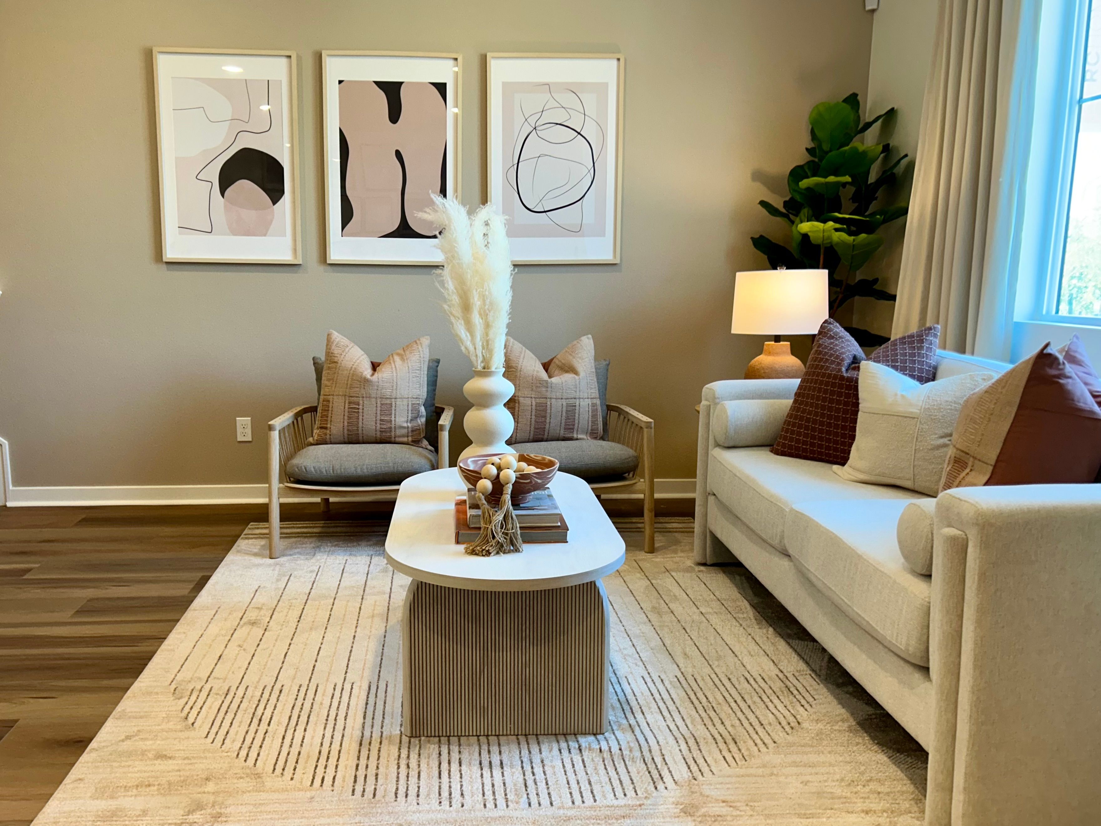 Model home open-concept living area with plenty of natural light from the window