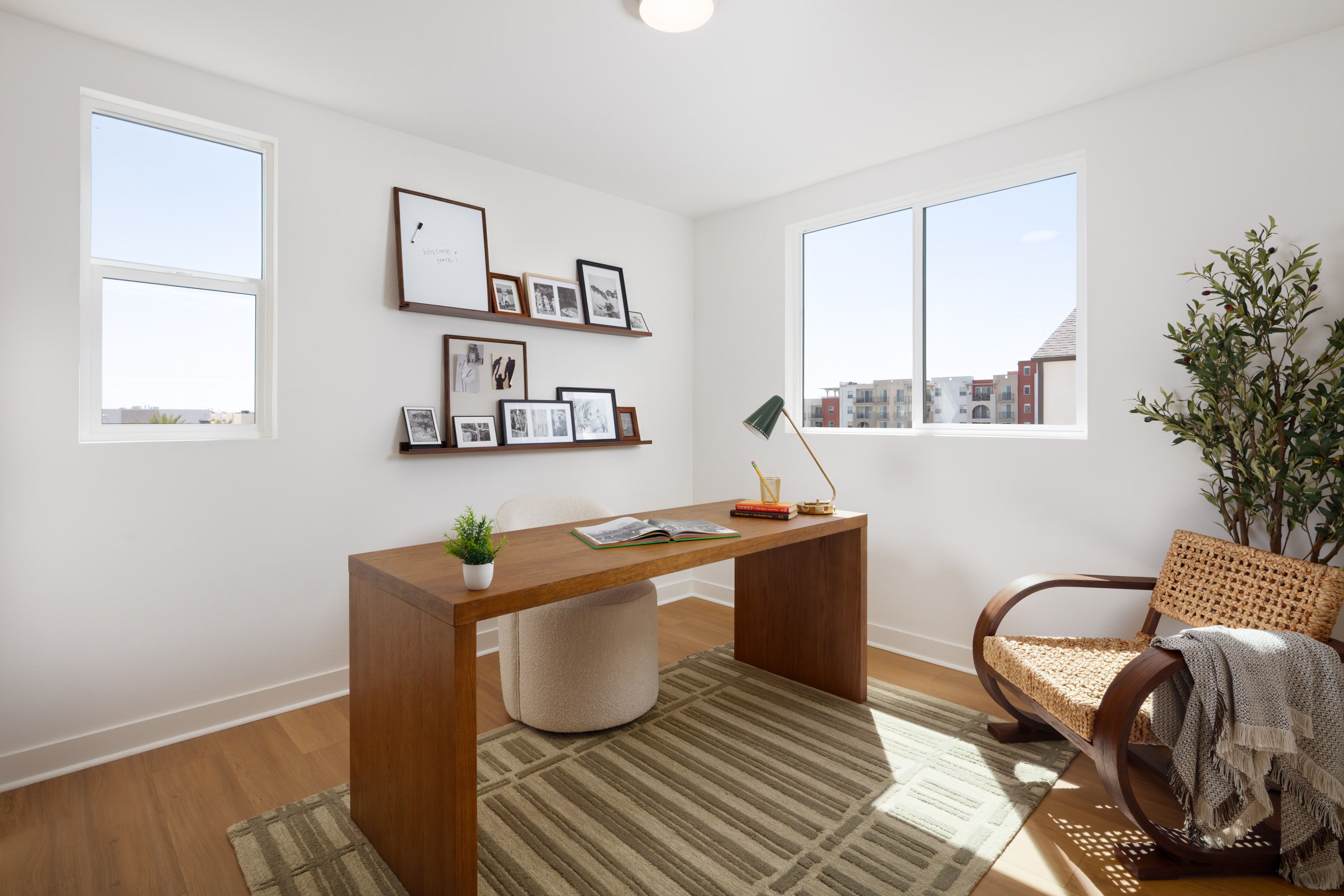 Model home bright secondary bedroom 2 featuring a large window and comfortable layout.