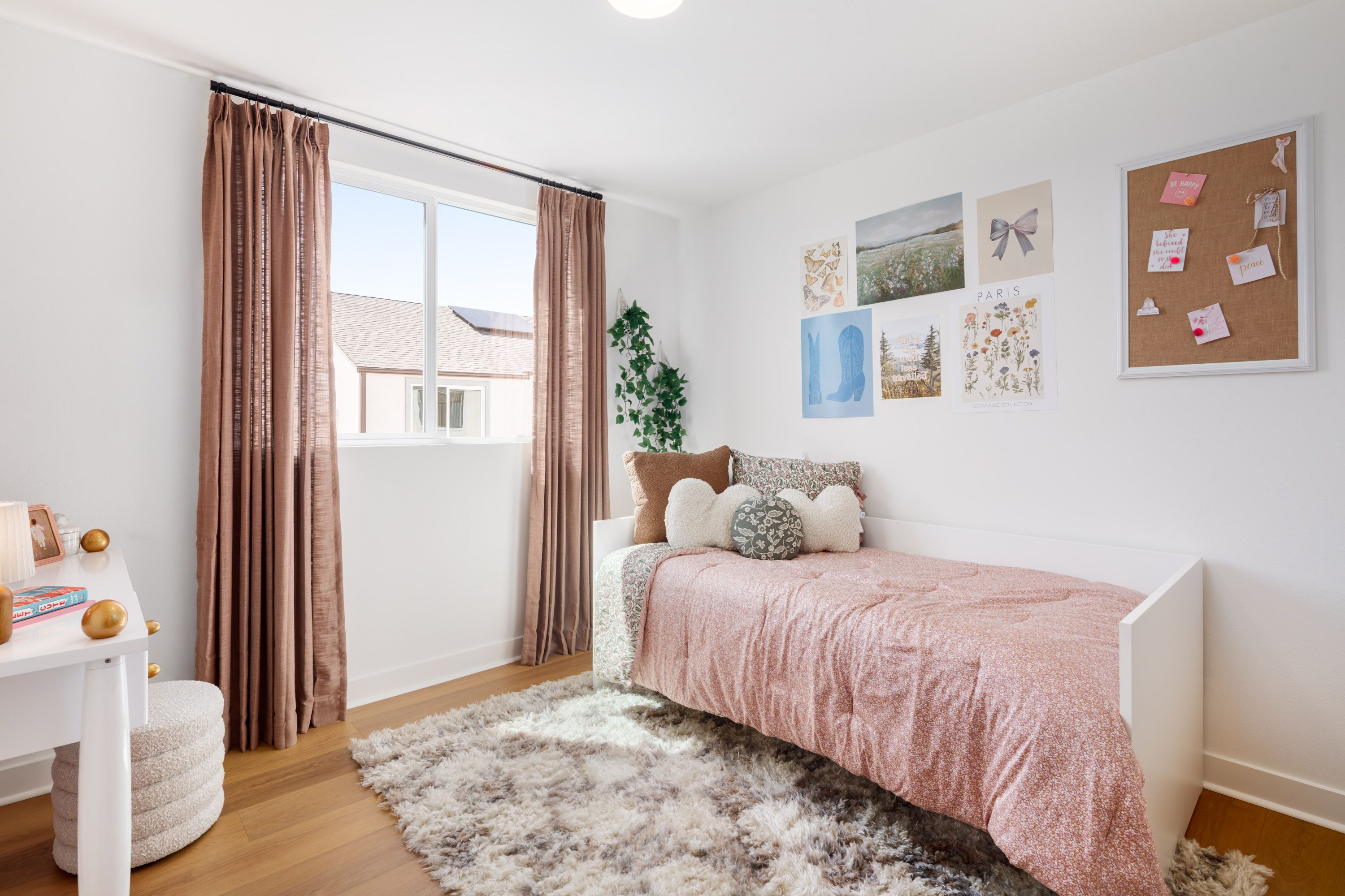Model home well-proportioned secondary bedroom 3 featuring a large window and thoughtful design