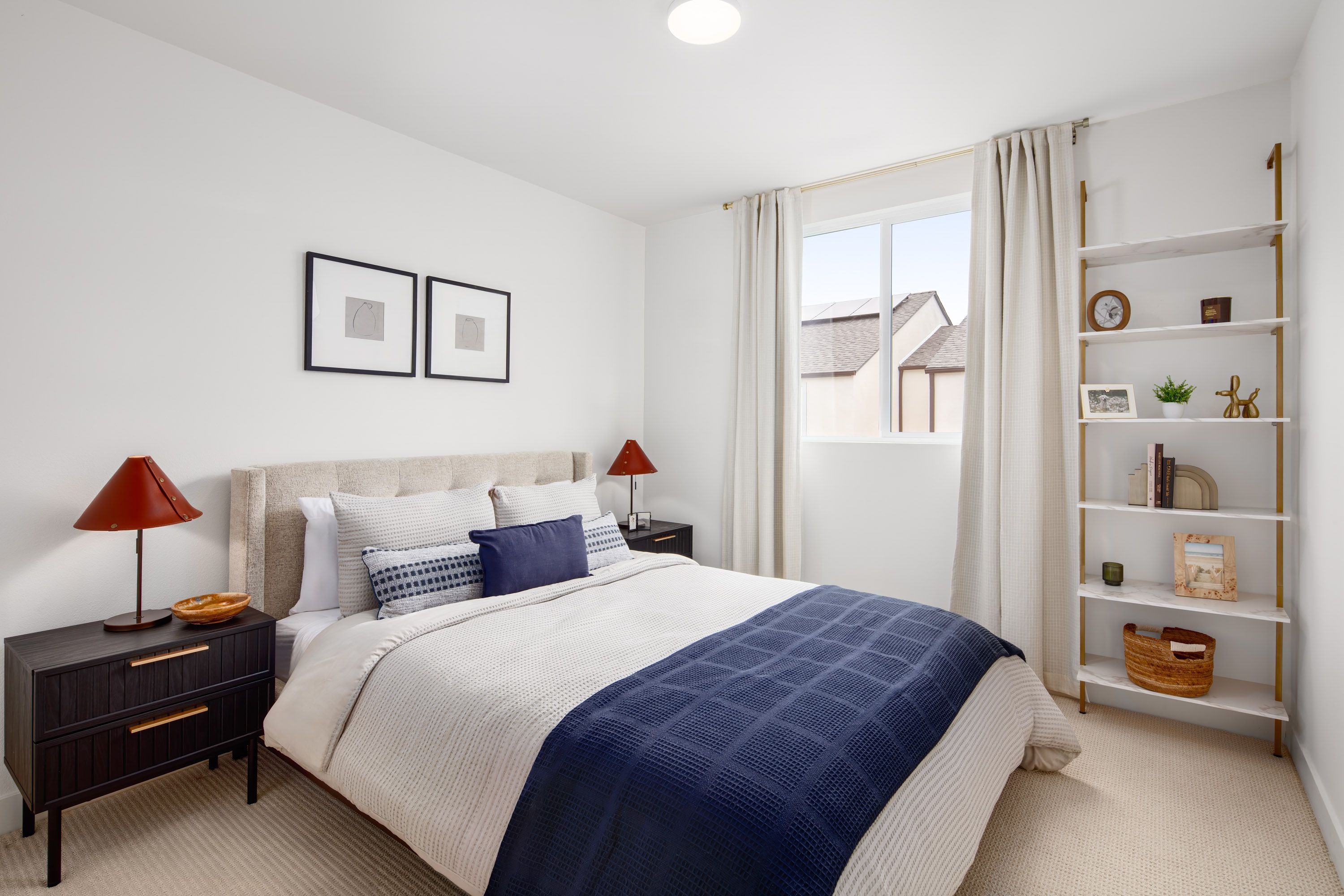 Model home bright secondary bedroom 2 featuring a large window and a comfortable layout