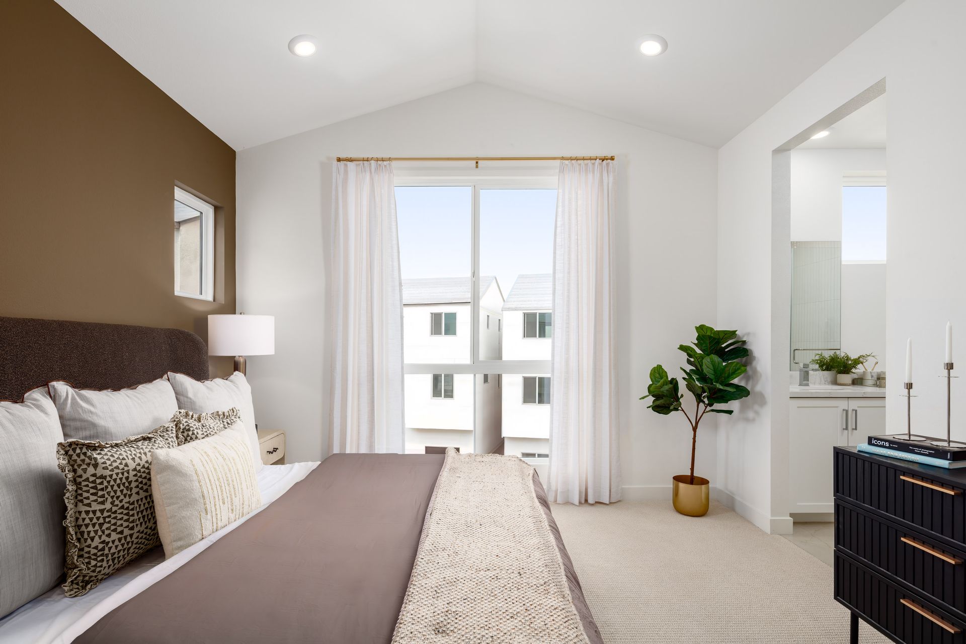 Model home large primary bedroom with ensuite Bathroom and vaulted ceilings