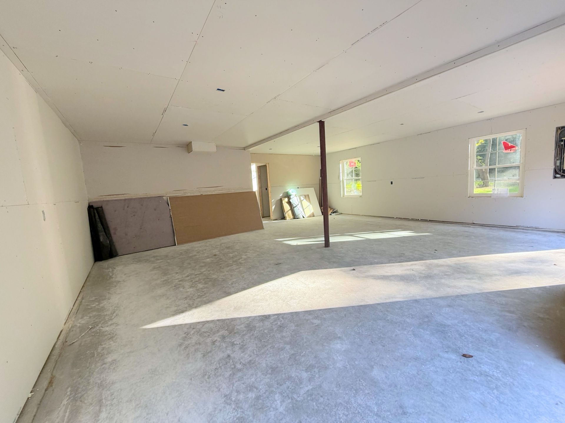Garage interior construction detail showing framing and finish work progressing.