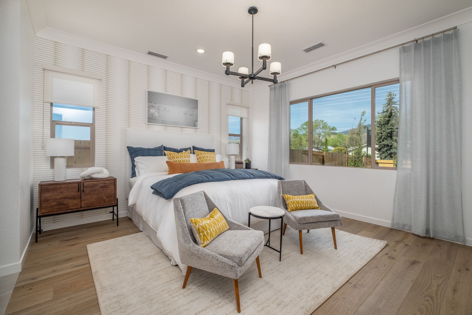 Our Plan 2's Spacious Primary Bedroom With Large Windows For Natural Lighting