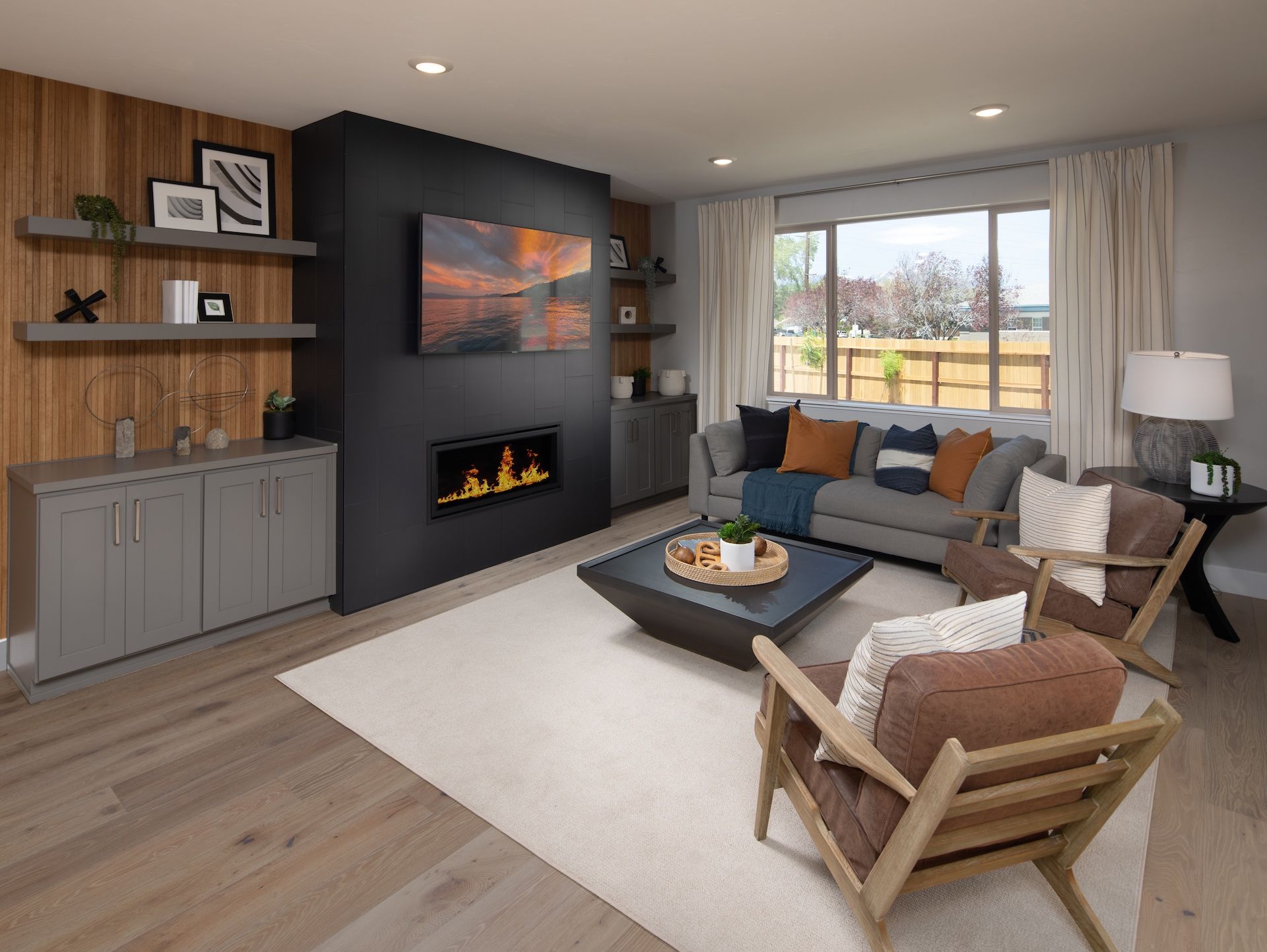 The Plan 4X Great Room With A Linear Style Fireplace & Built In Cabinets