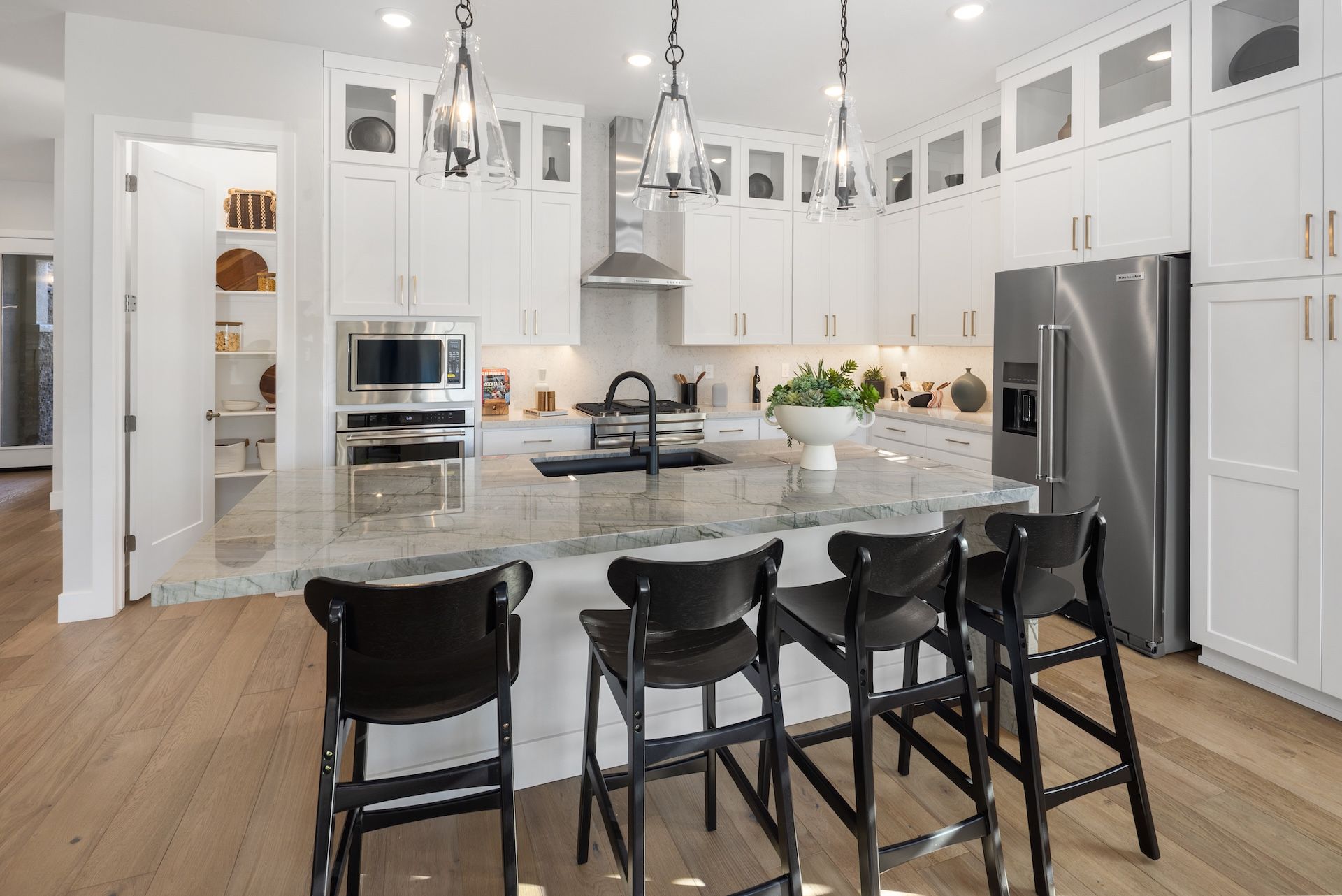 The Kitchen With Extended Upper Cabinets With Glass Doors In Our Plan 3