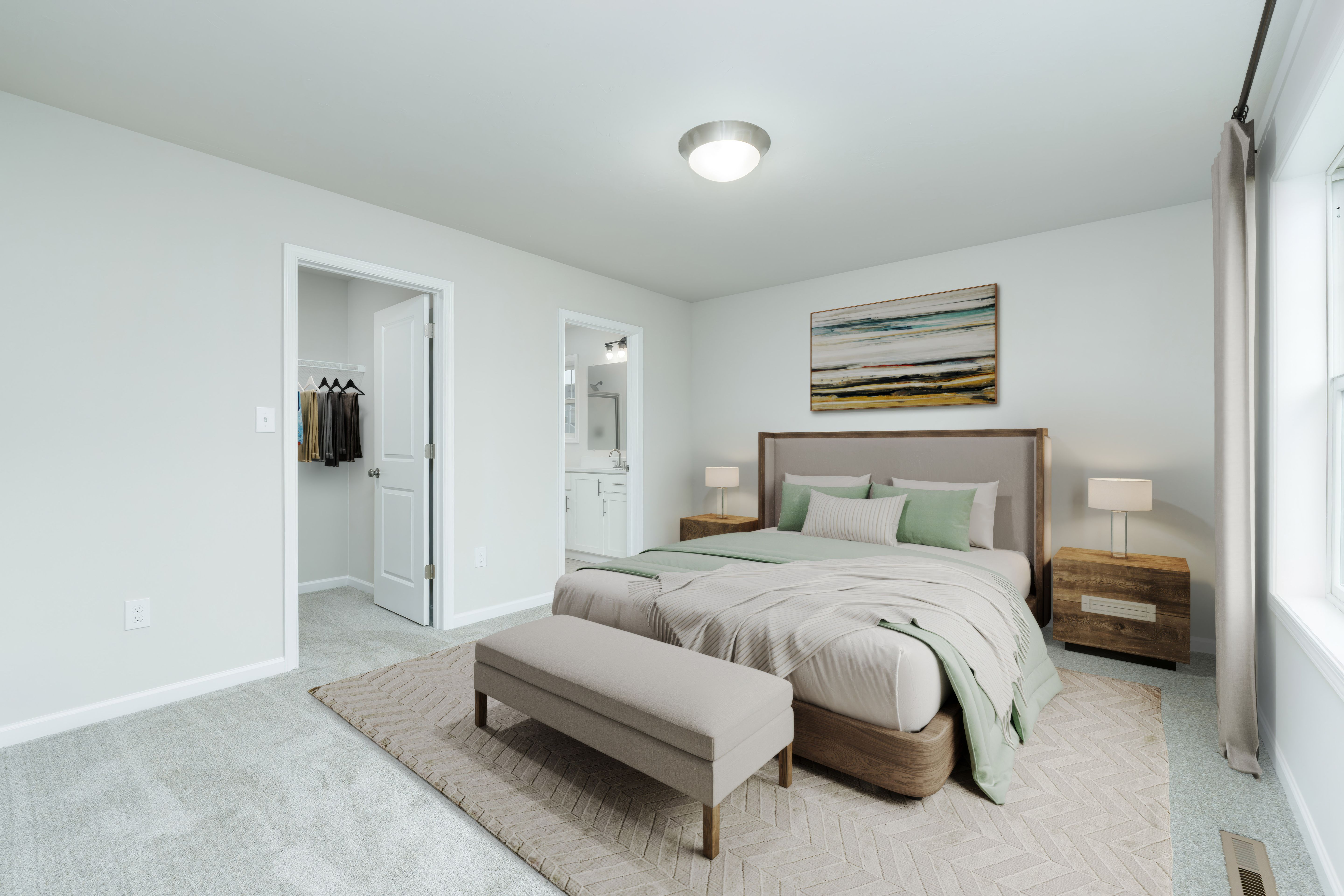 Owners bedroom with upholstered bed, bench seating, nightstands, and soft carpet flooring.