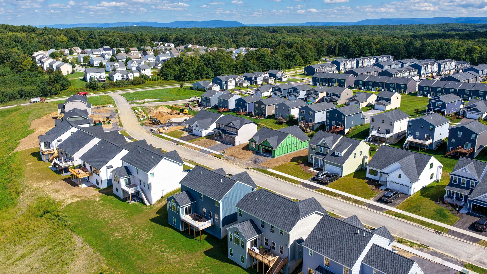 Aerial view of single-family homes and new home construction at Grays Pointe in Port Matilda, PA, su