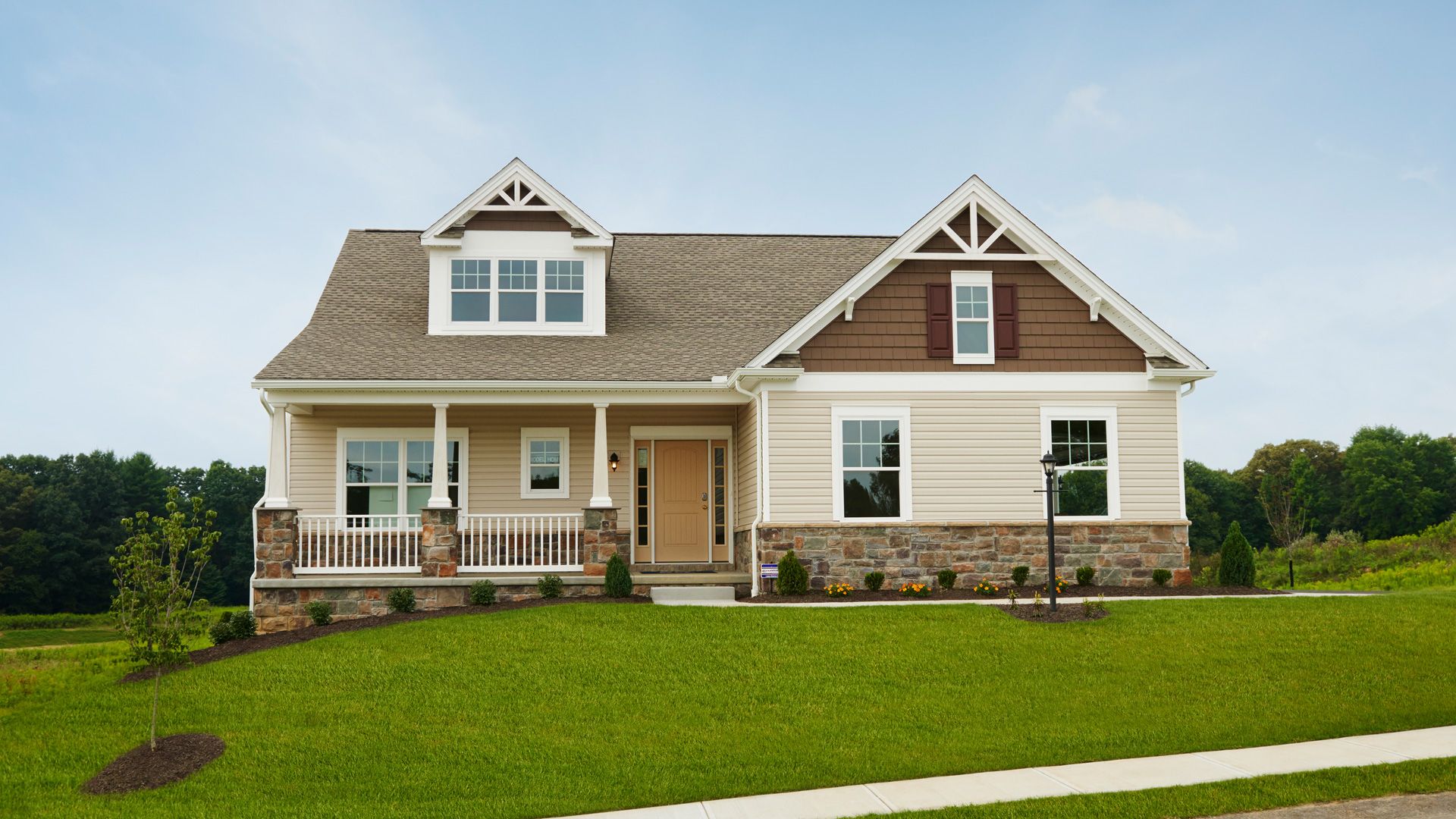 Exterior front view of the Aspen C Craftsman style ranch with side entry garage by S&A Homes