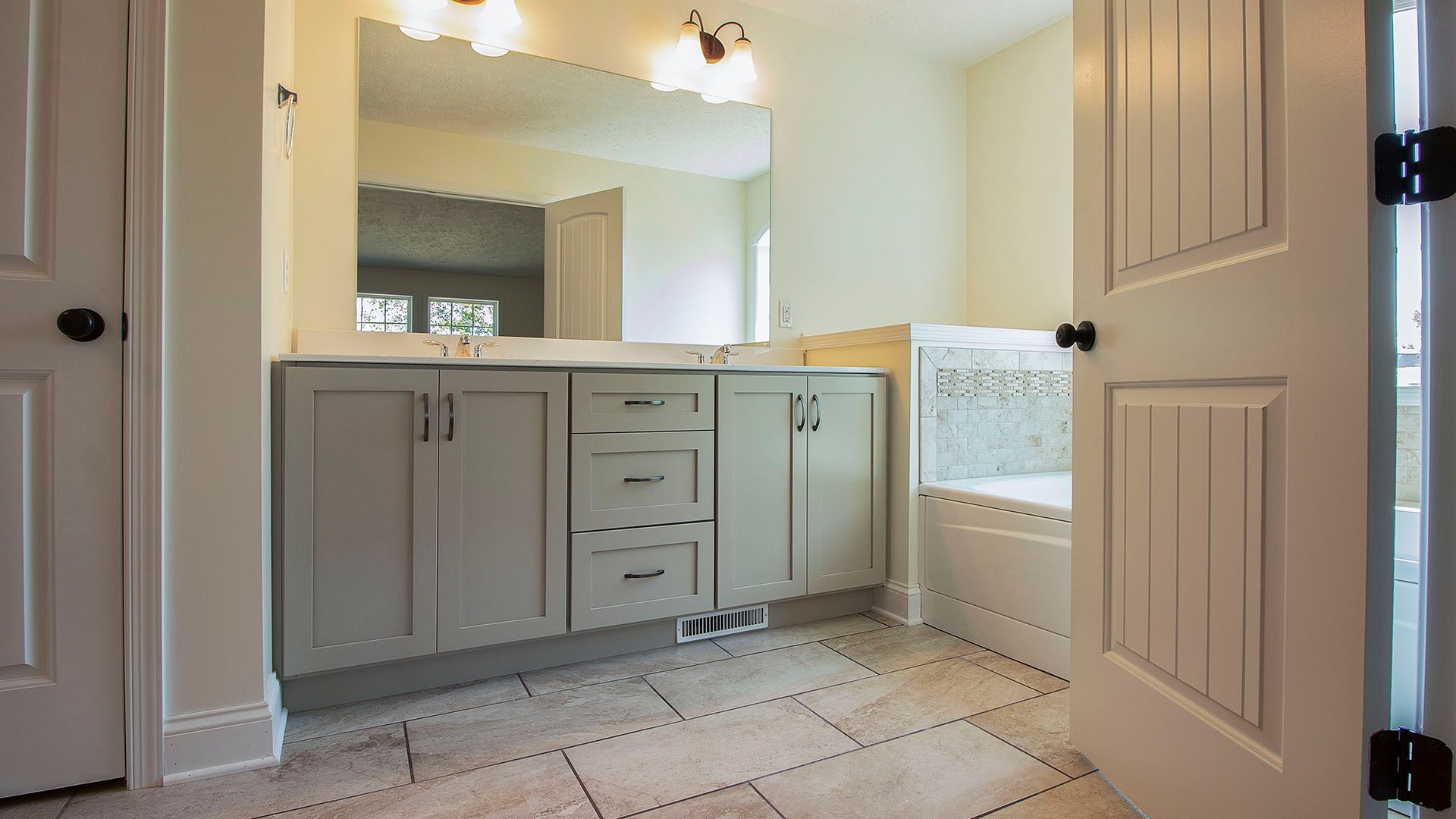 Double door entry to luxury owners bath, Aspen floorplan