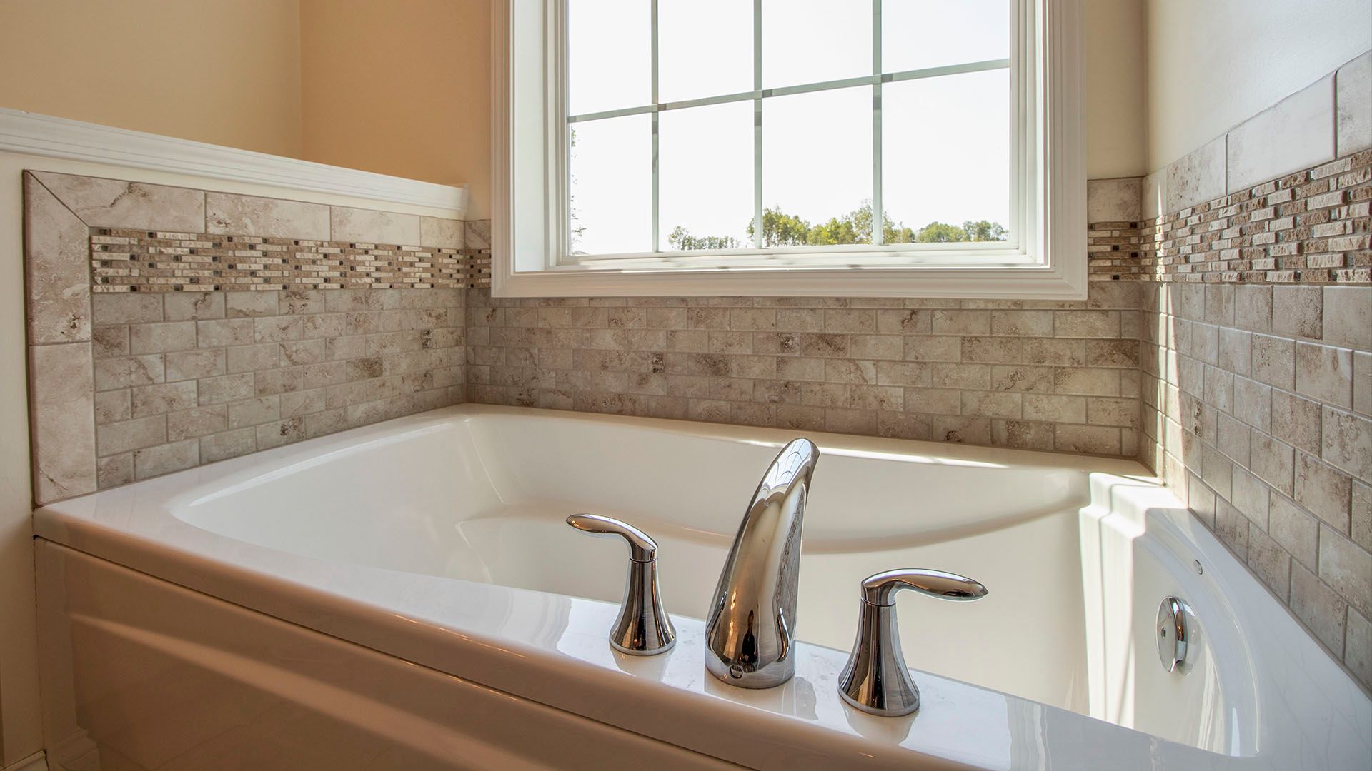 Soaking tub with large window above