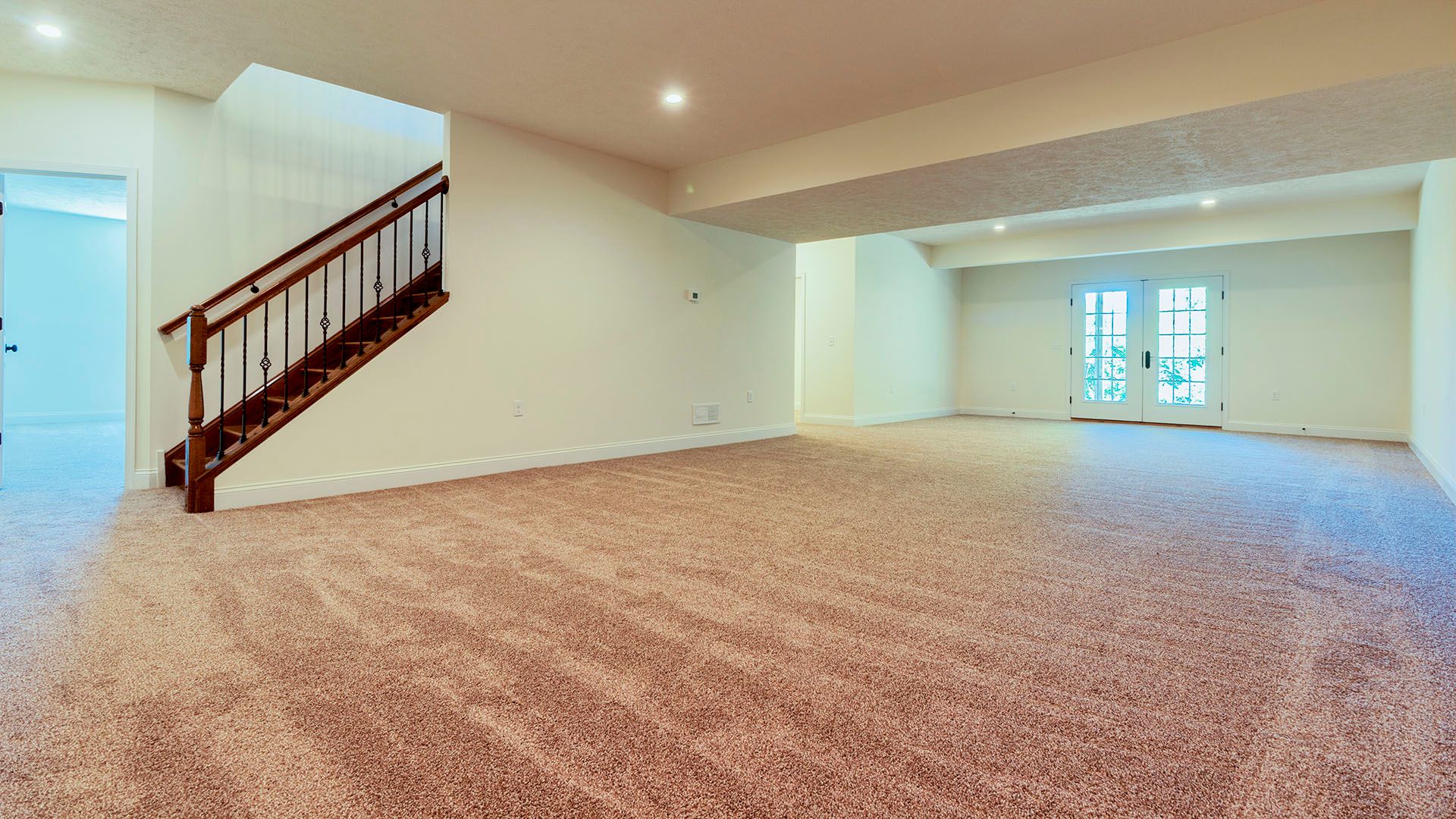Optional finished basement with double doors to outside in Aspen floorplan