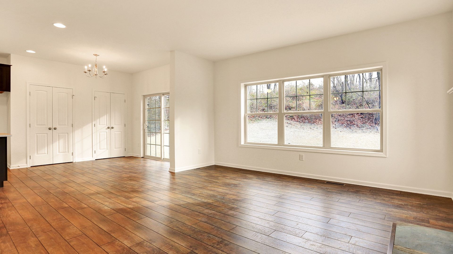 Triple windows and sliding glass door in the Fairmont plan by S&A Homes