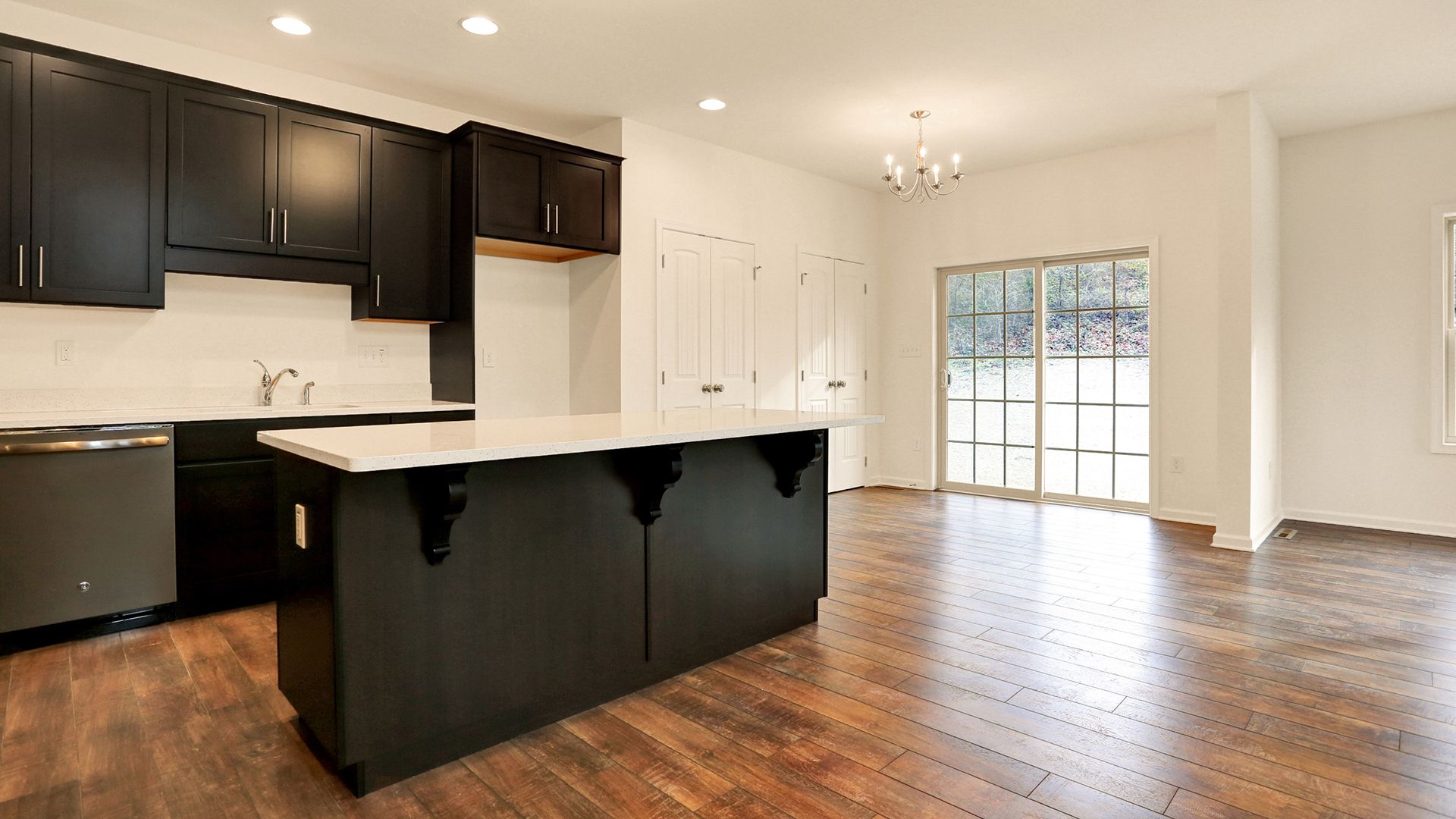 Kitchen with dark cabinets and center island, Fairmont plan by S&A Homes