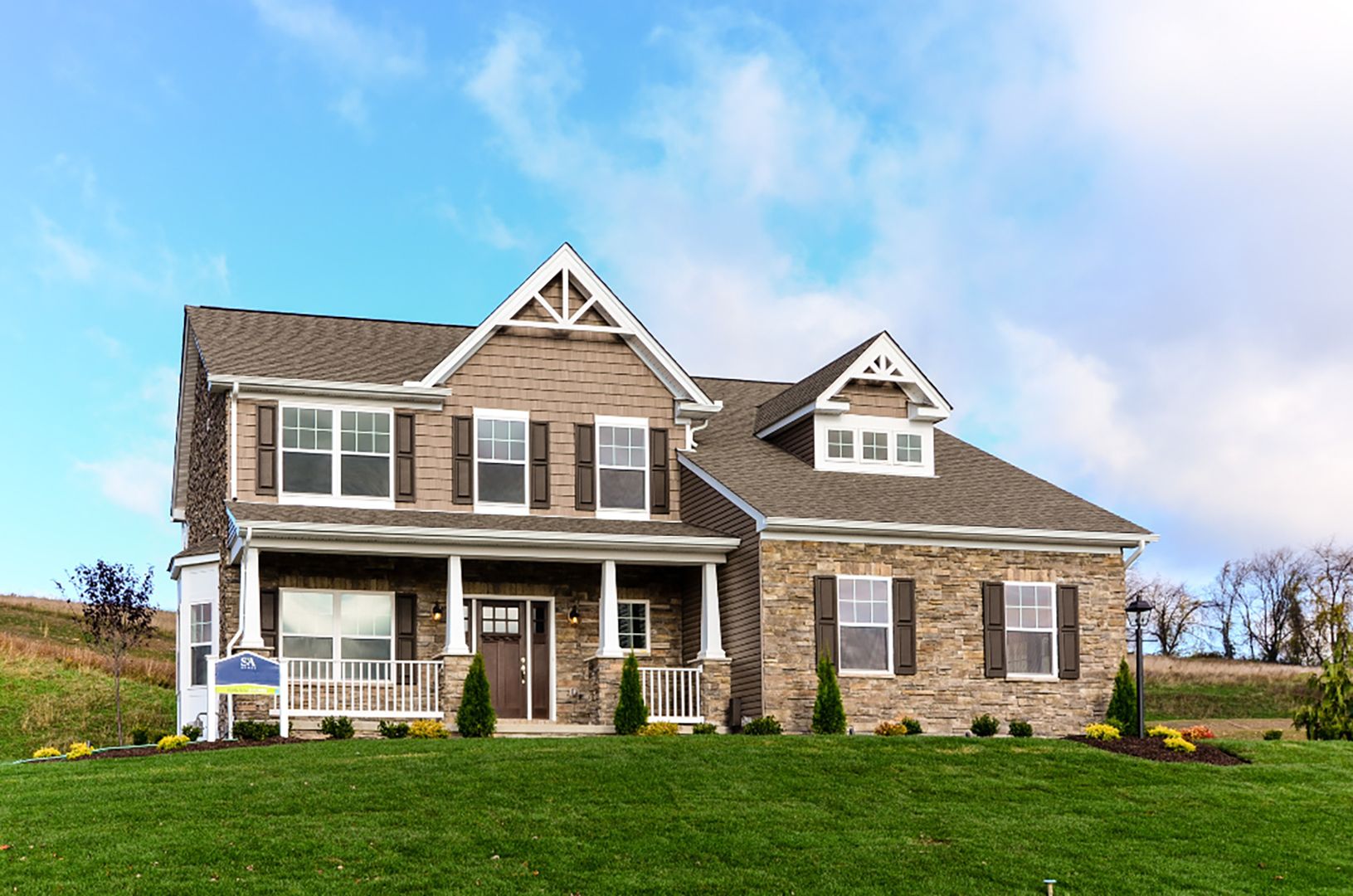 The Newport C - S&A Homes - exterior view - 2 story home with full stone front and large porch, side entry garage with dormer