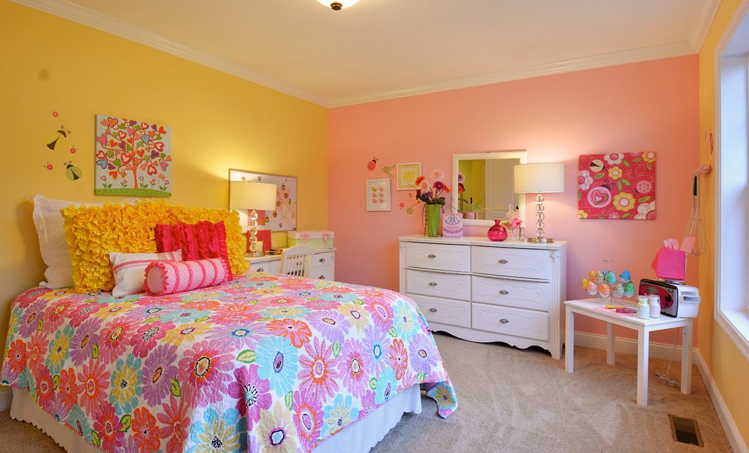 Furnished kids room with bed desk and dresser