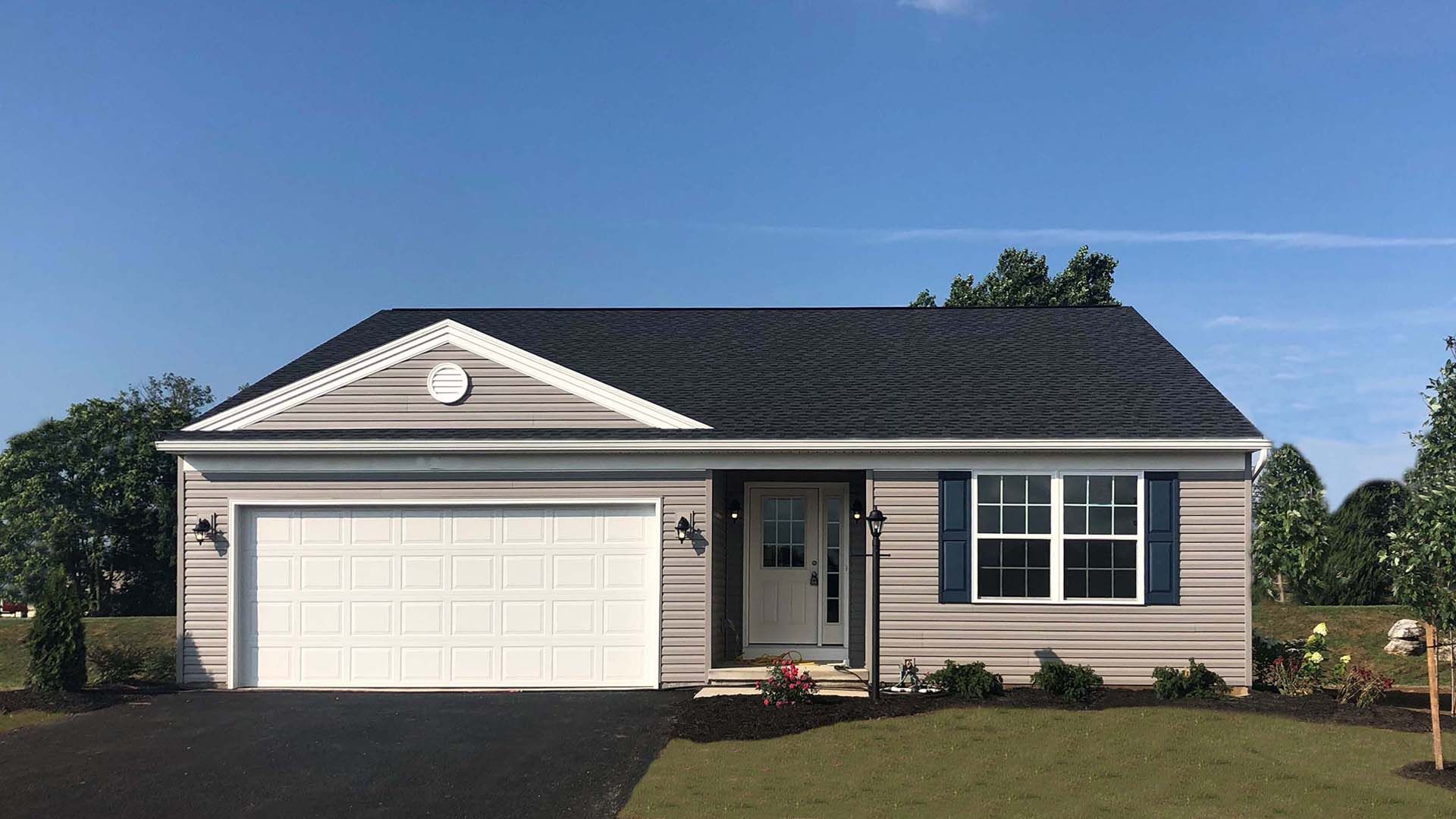 Exterior front view of the Elmcrest ranch by S&A Homes - single story home with vinyl siding and two car garage