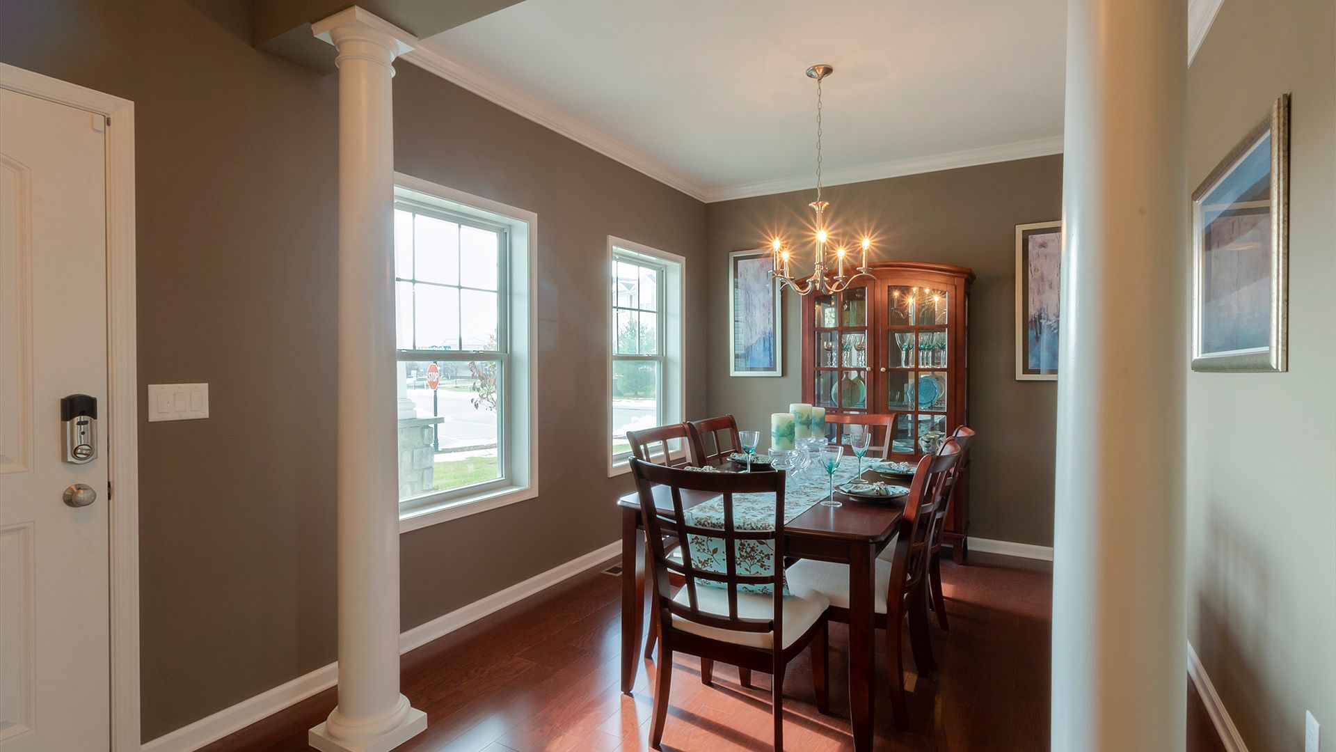 Formal dining room with decorative columns, Crestmont plan by S&A Homes
