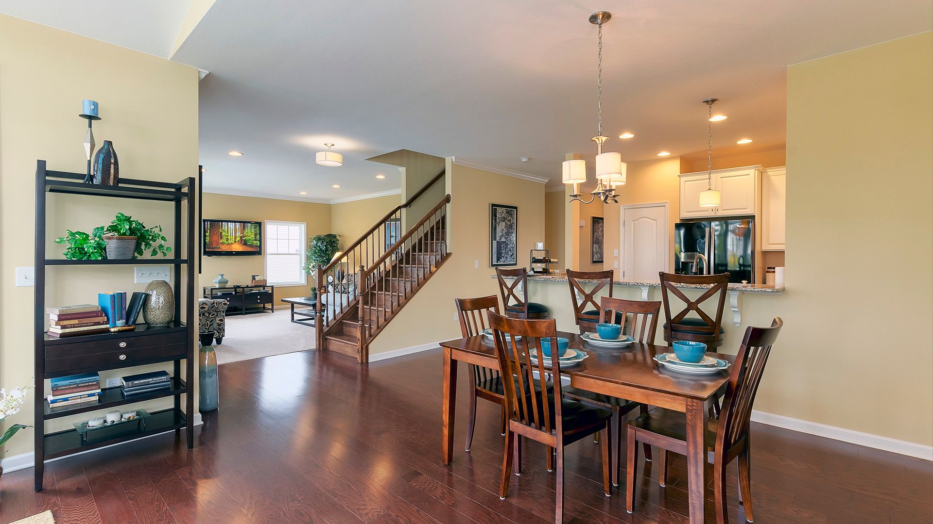 Breakfast area, kitchen, stairs to second level and family room, Crestmont plan by S&A Homes