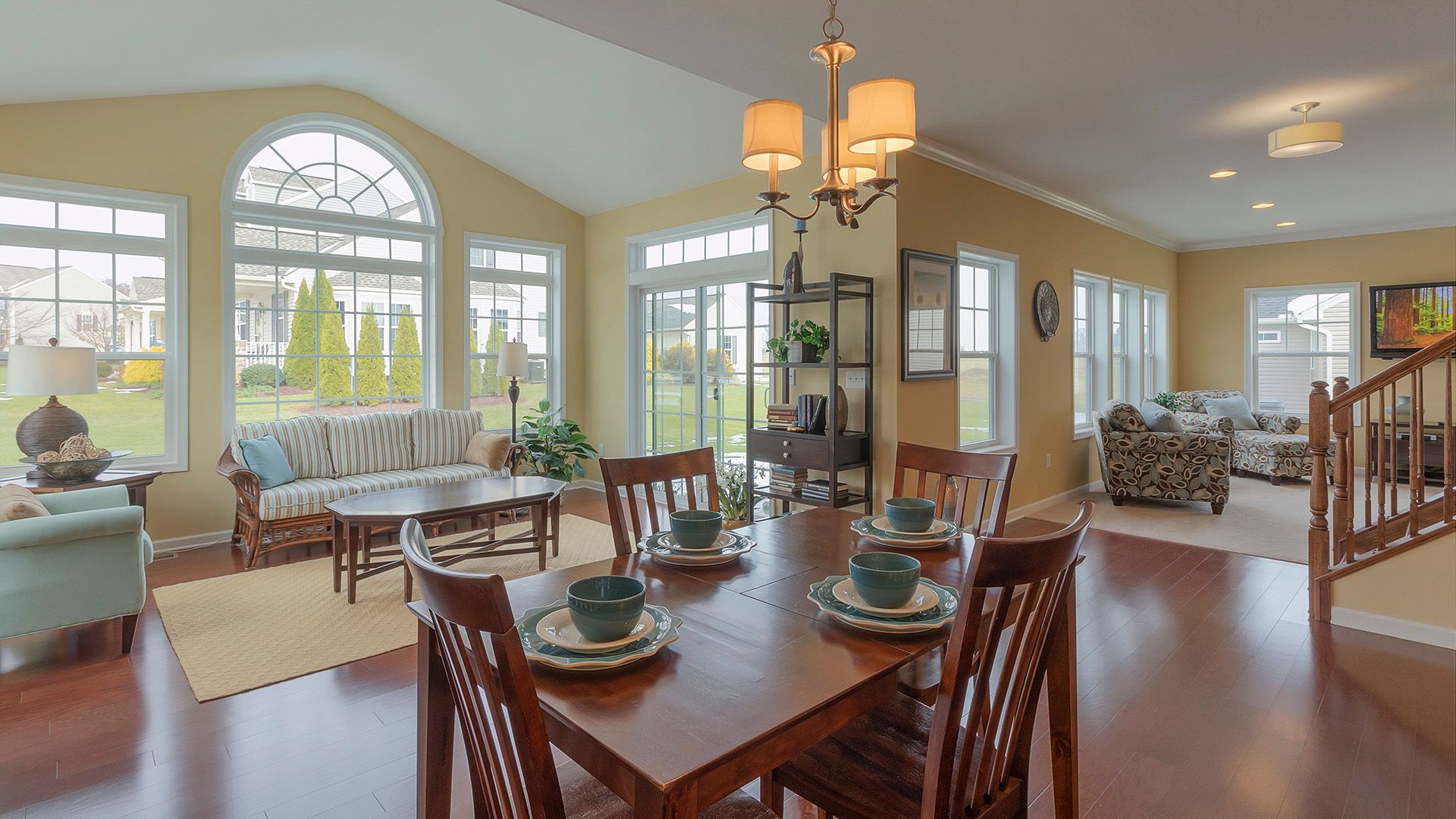 Breakfast nook, rear morning room, and family room areas with hardwood flooring in Crestmont plan by S&A Homes