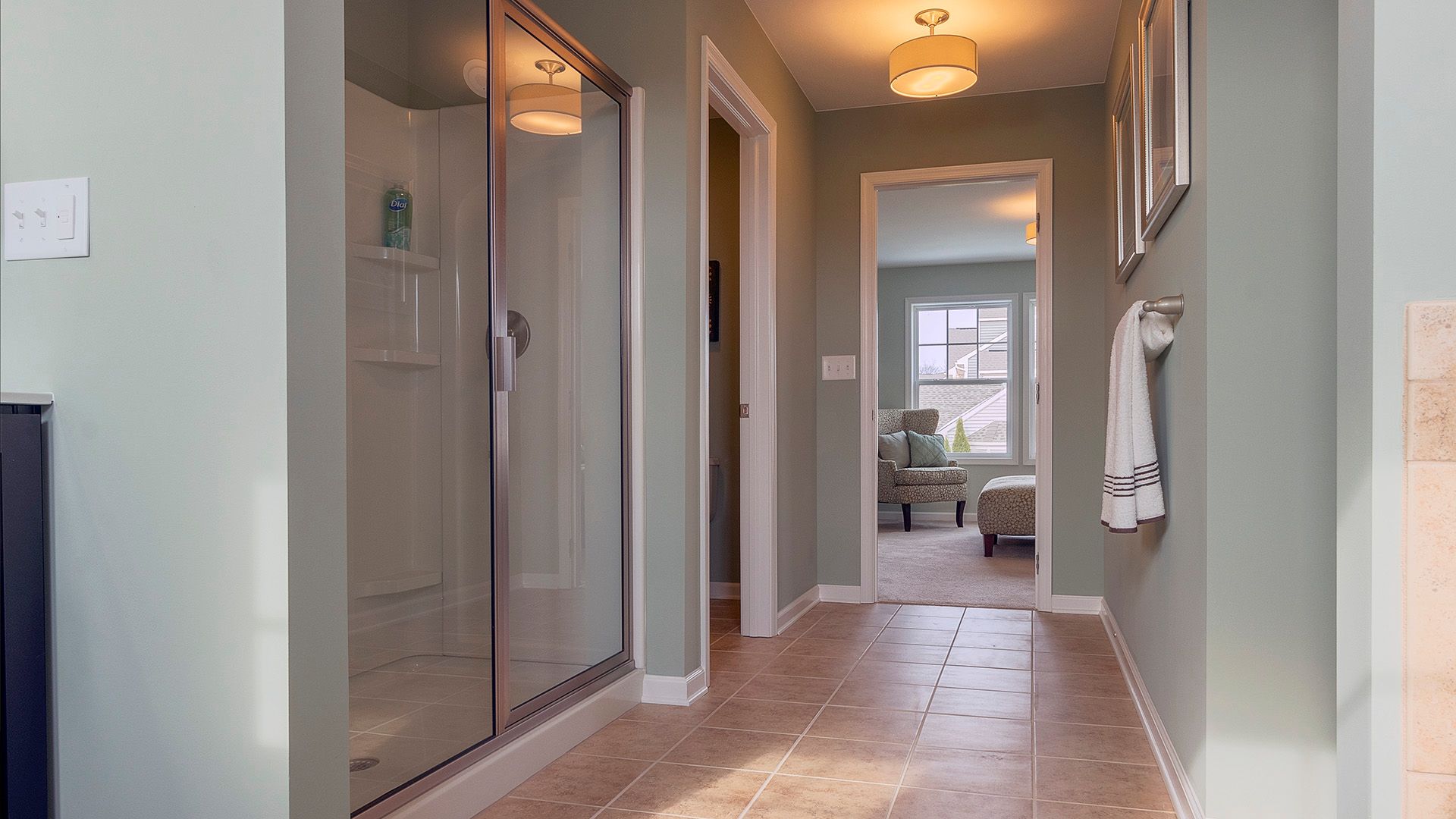 Owners bath with glass door shower stall, ceramic tile flooring