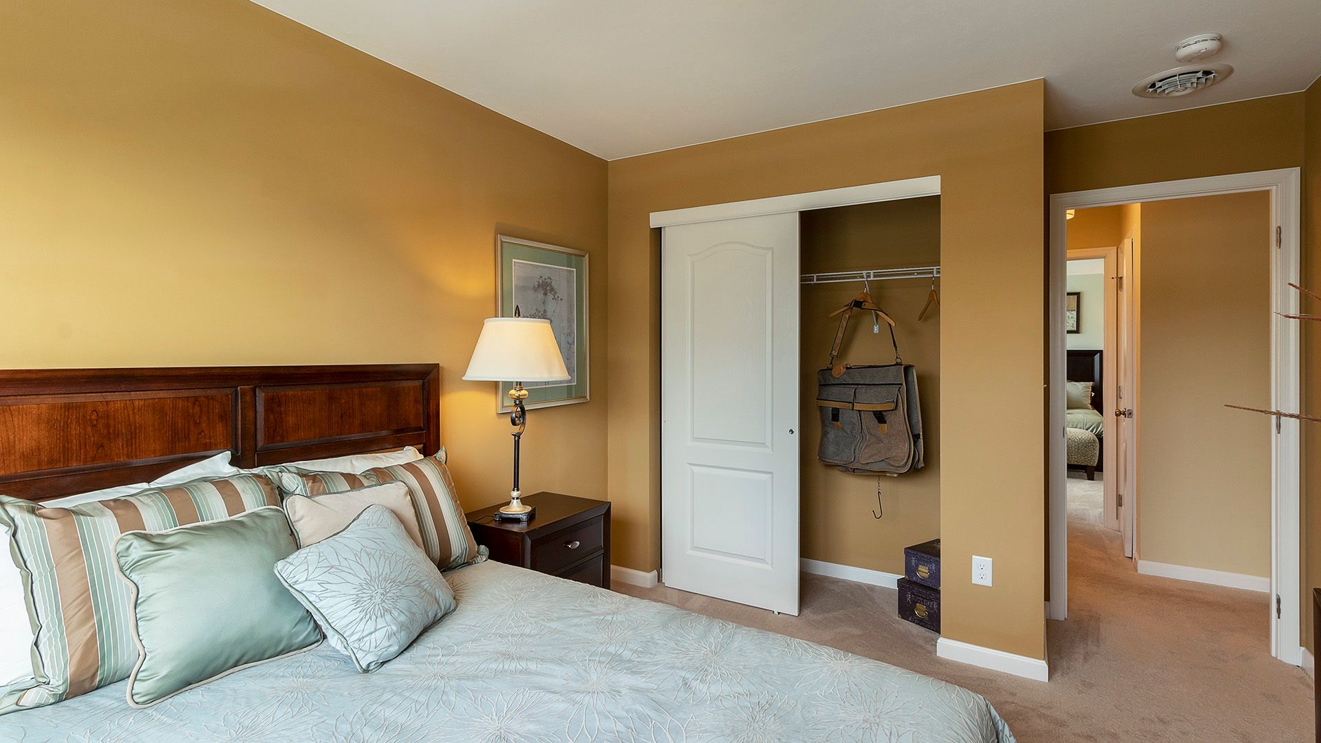 Furnished guest room, bedroom four in the Crestmont floorplan by S&A Homes