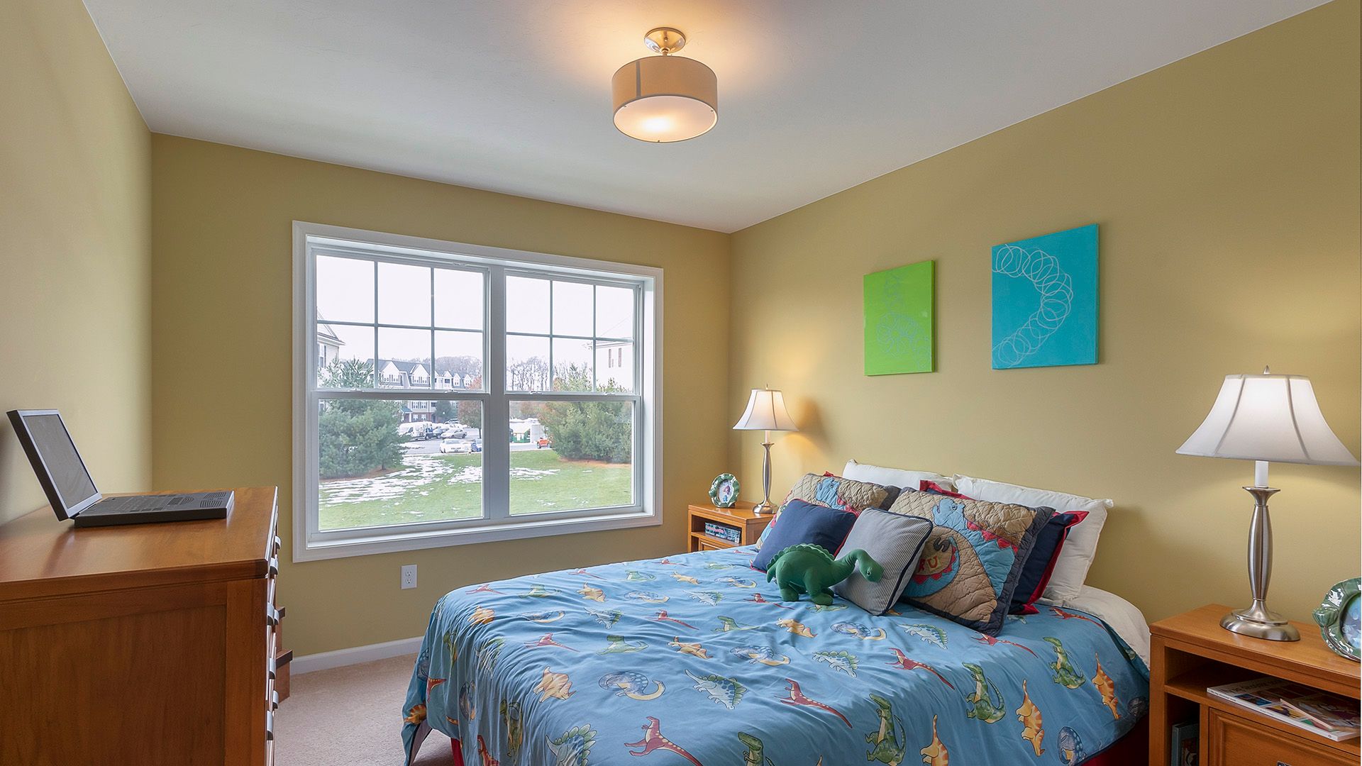 Furnished kids room, bedroom two in the Crestmont floorplan by S&A Homes