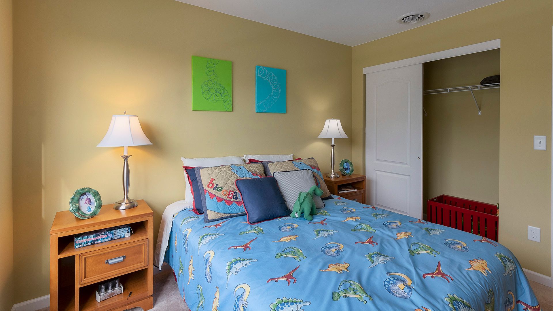 Furnished kids room, bedroom two in the Crestmont floorplan by S&A Homes