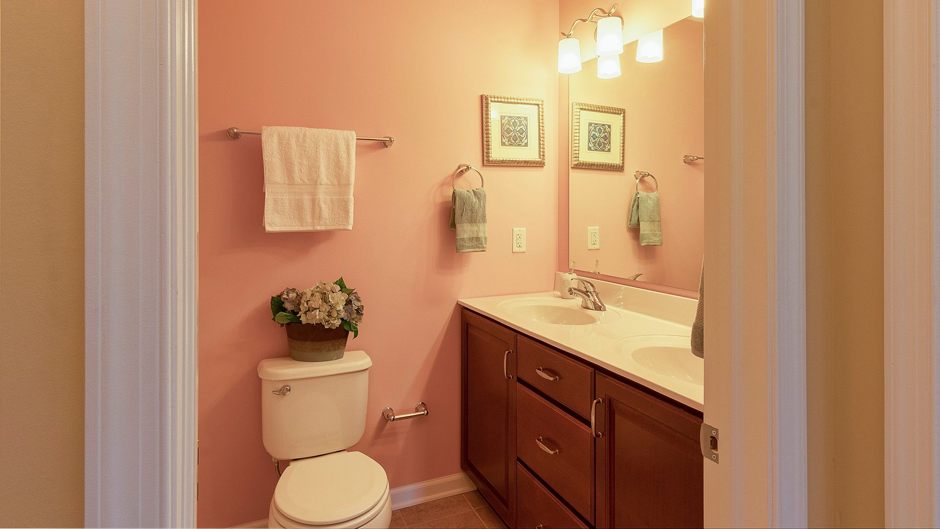 Hall bathroom with double bowl vanity, maple cabinets and mirror, Crestmont floorplan