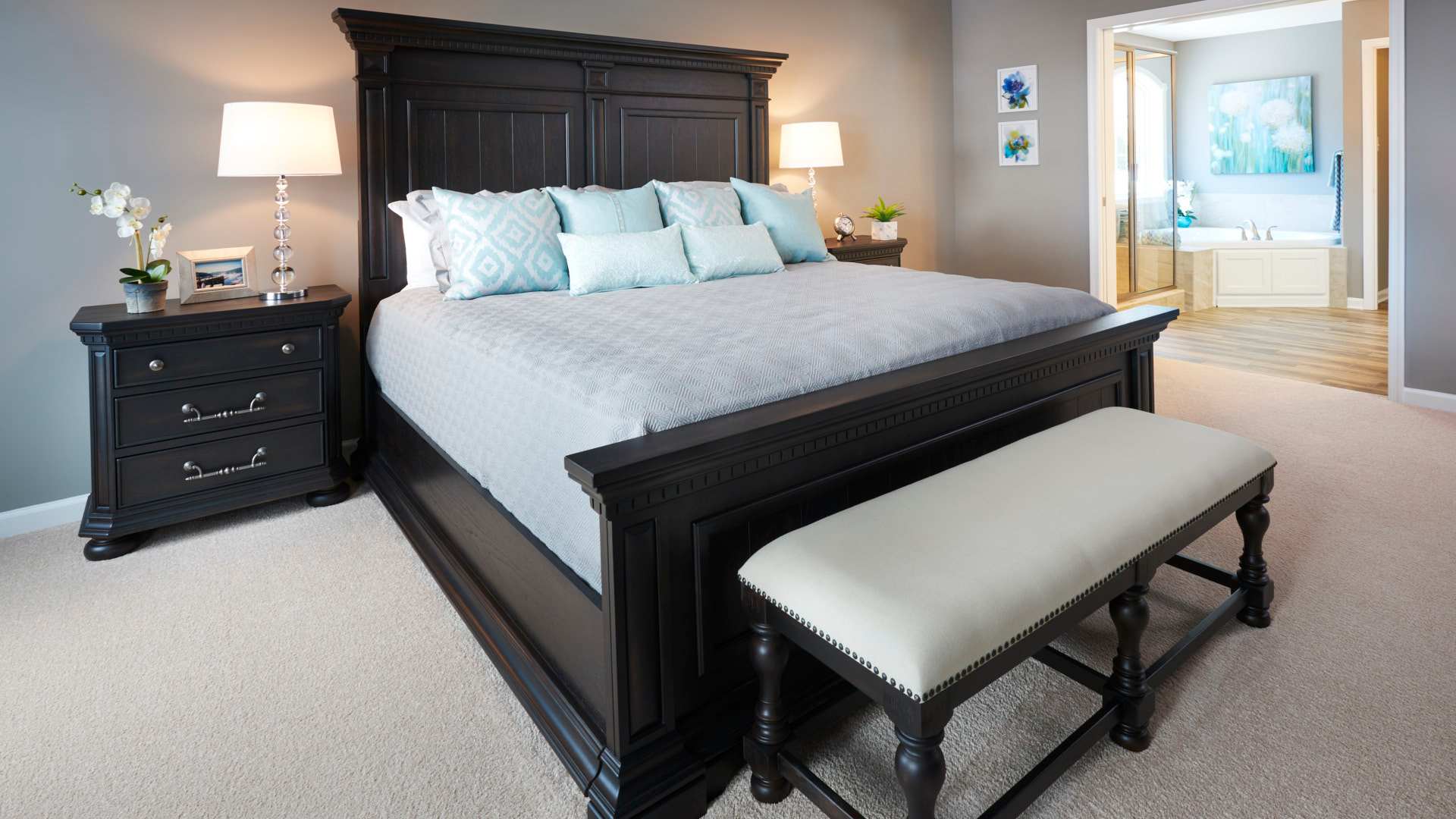 Furnished owner's bedroom with carpeted floor - facing entry to owner's bath