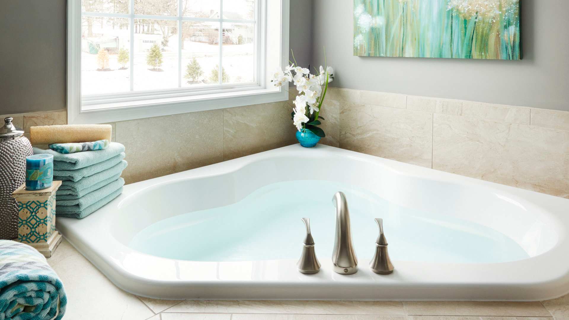 Corner soaking tub with window above - filled with water
