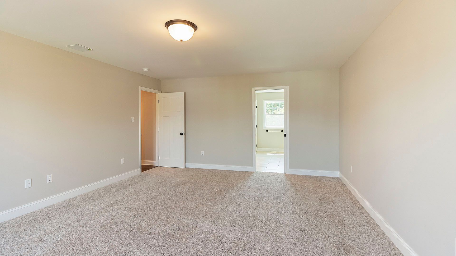 Owners Bedroom with door leading to bathroom