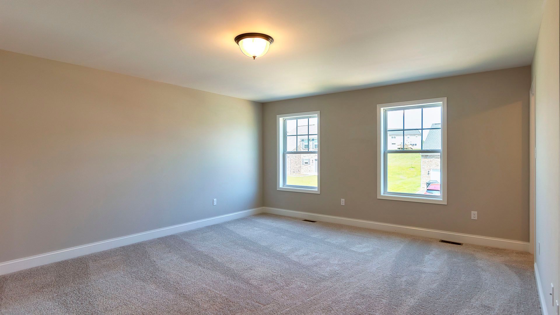 Owner's bedroom with 2 windows, carpet