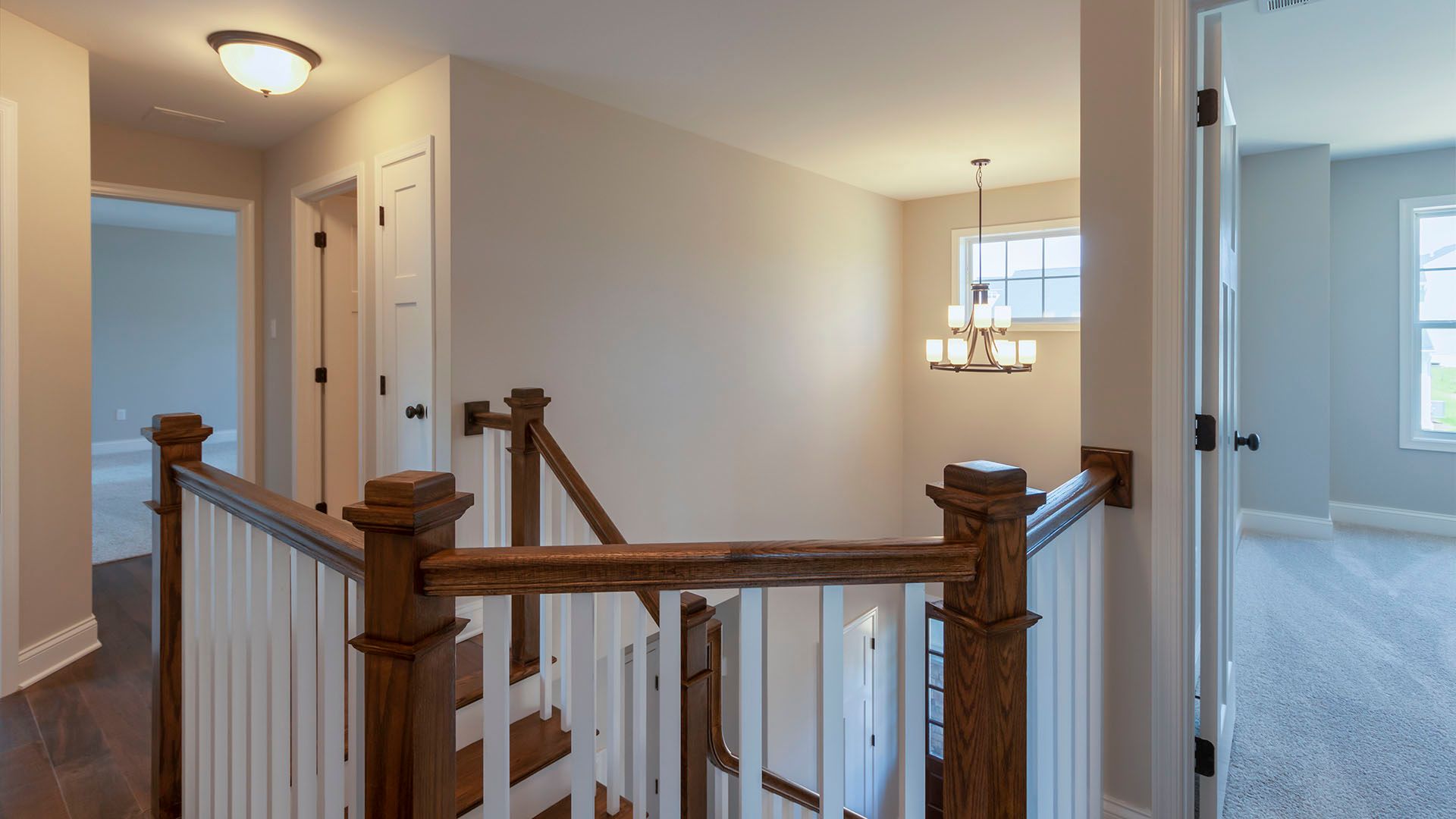 Upstairs hallway with hardwood