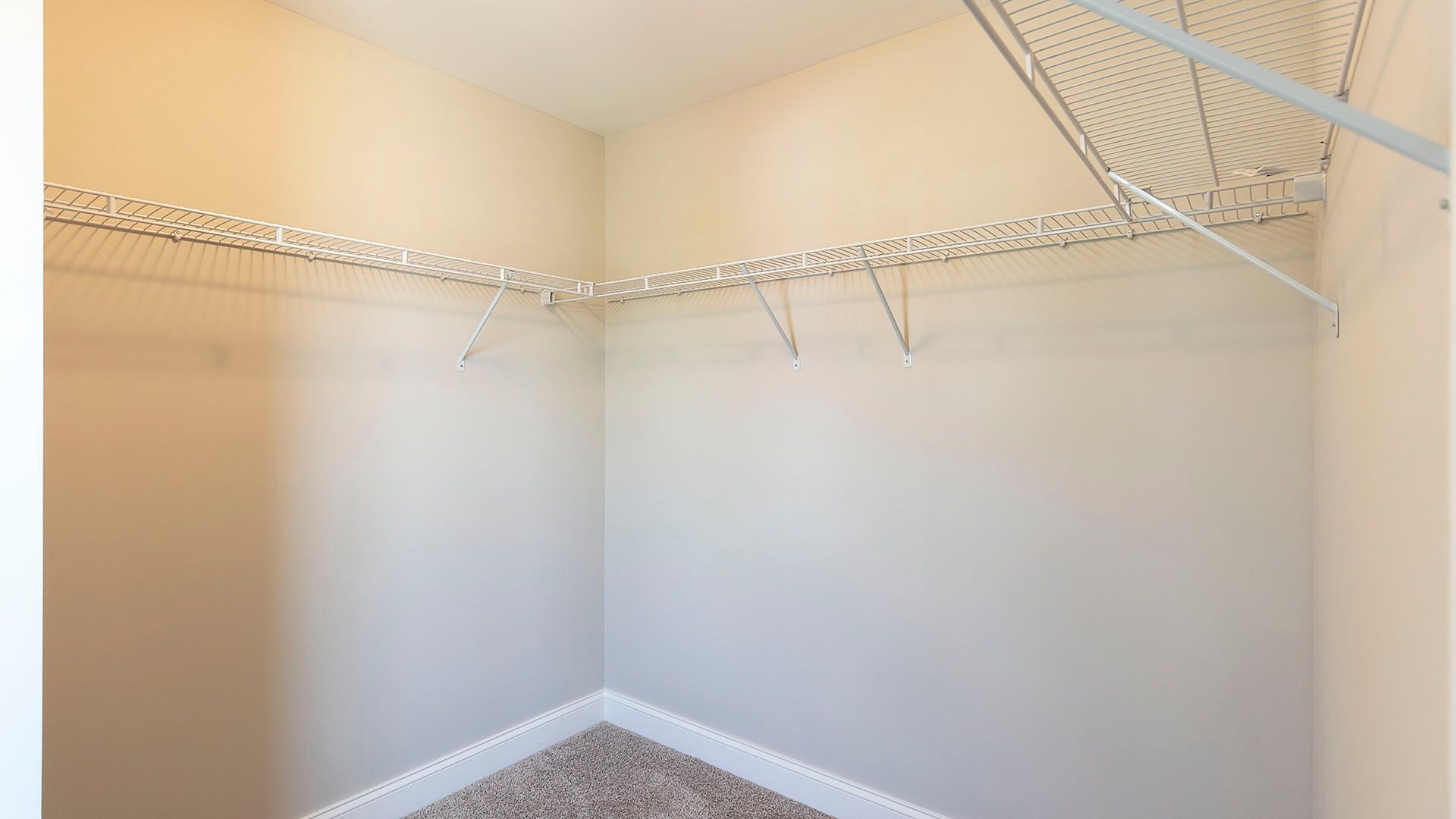 Owner's walk in closet with wire shelving