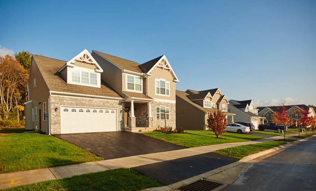 Honors Crossing II in State College by S&A Homes - streetcape view -two story homes with cars in driveways