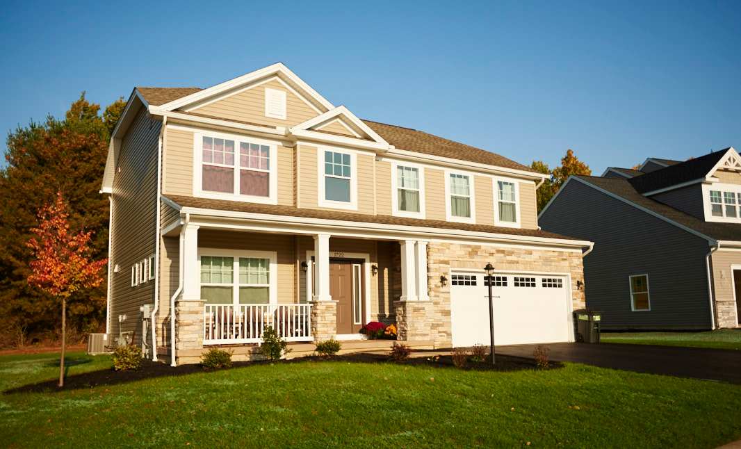 The Greenwood C floorplan by S&A Homes- 2 story home with porch, partial stone front, two car garage