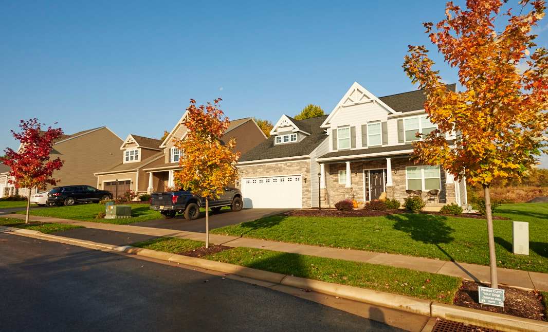 Honors Crossing II in State College by S&A Homes - streetcape view -two story homes with cars in driveways