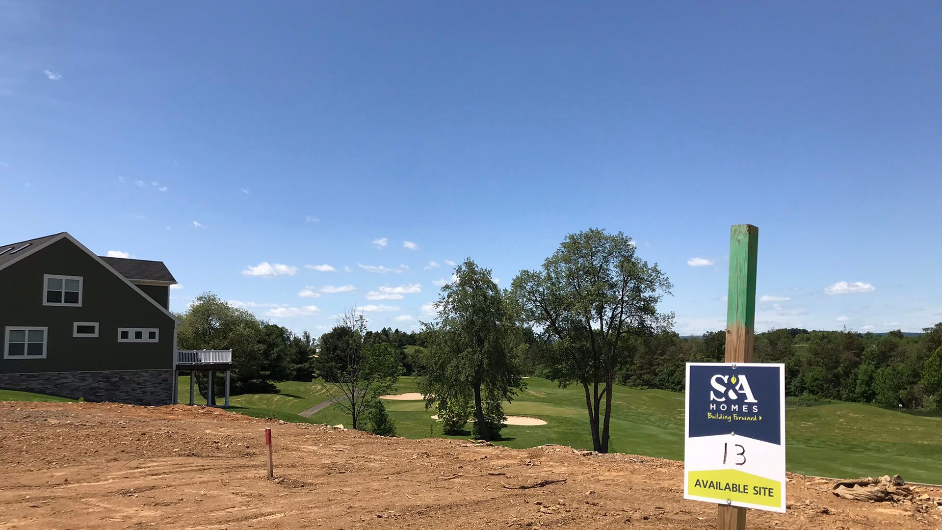 Village at Canterbury new home community in State College by S&A Homes - homesite 13 with the golf course in the background