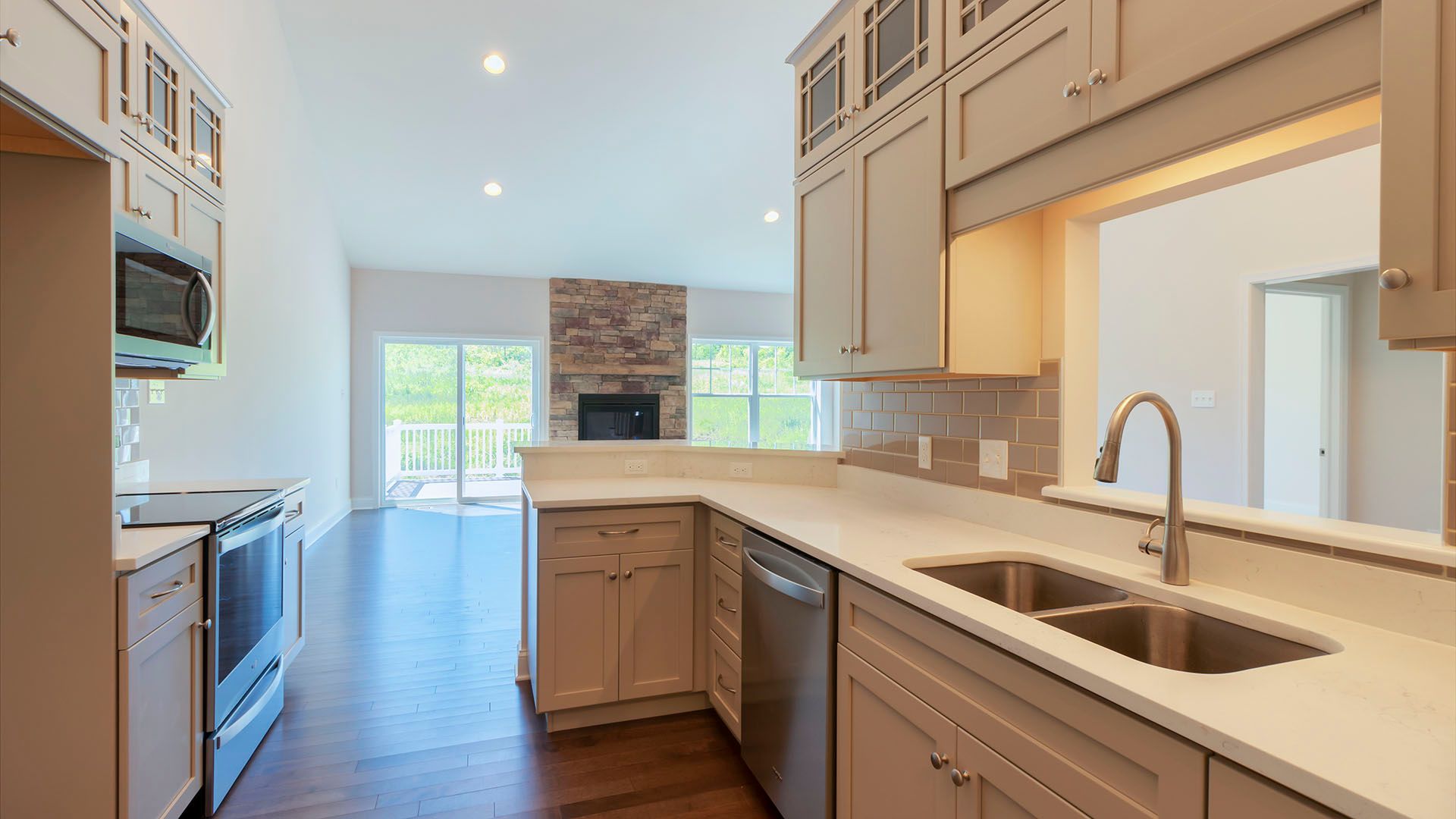 View from kitchen into family room area with firelace, Chilton plan